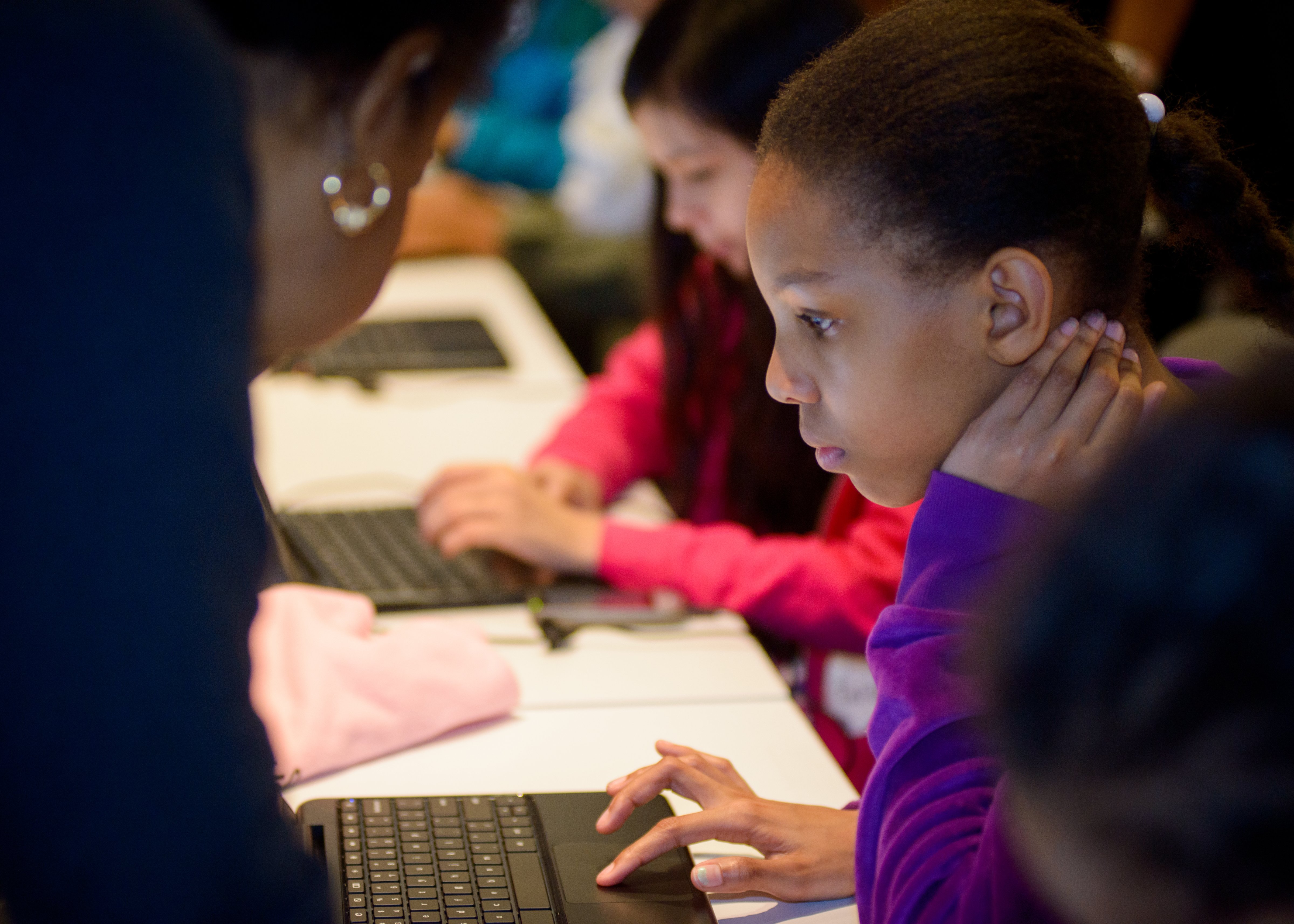 A young girl at a Black Girls Code program, who has partnered with , uses Made With Code (Google)