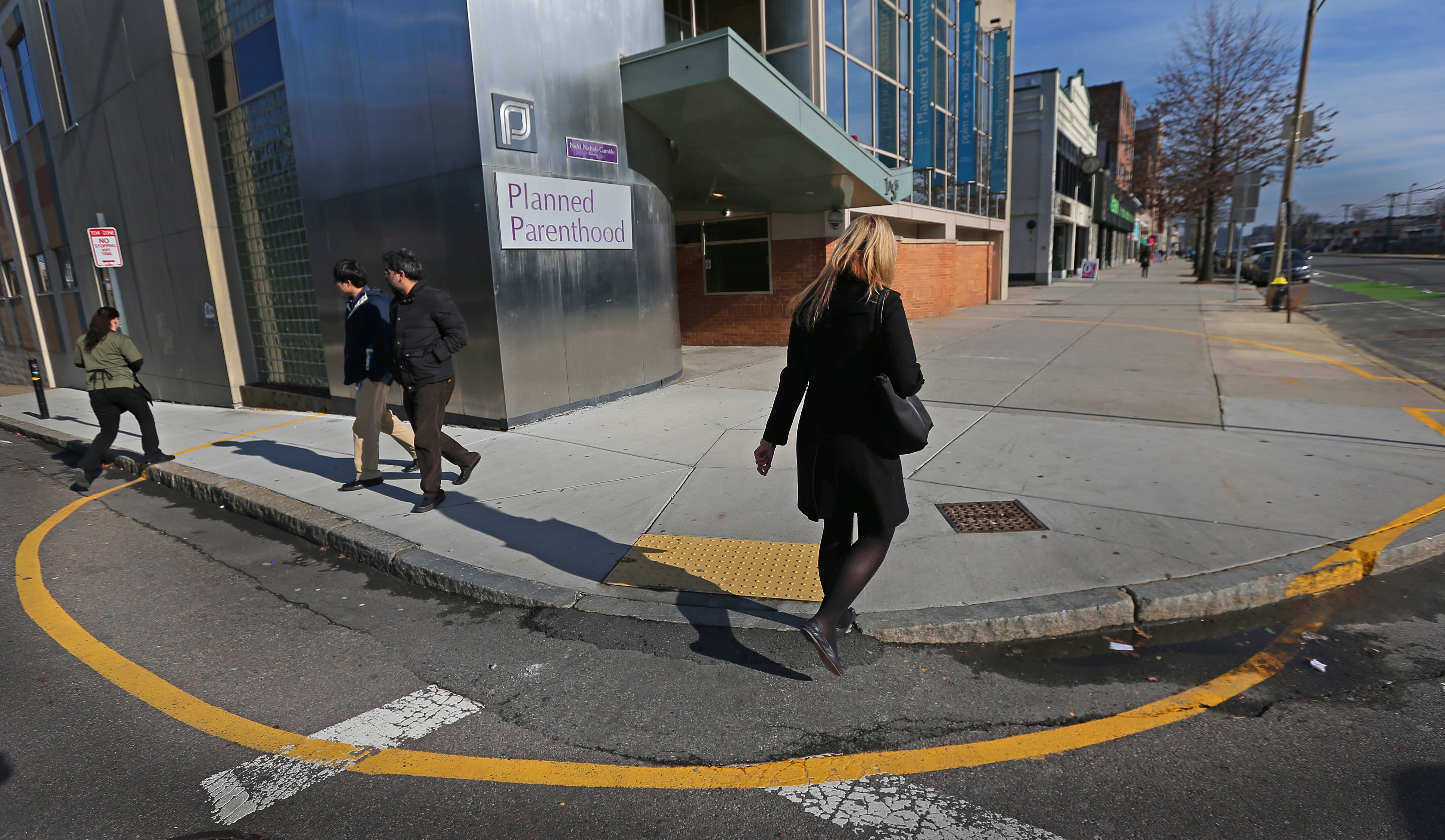 A yellow line is painted on the sidewalk and pavement surrounding Planned Parenthood Clinics at 1055 Commonwealth Ave., Boston, Jan. 15, 2014. (David L. Ryan—Boston Globe/Getty Images)