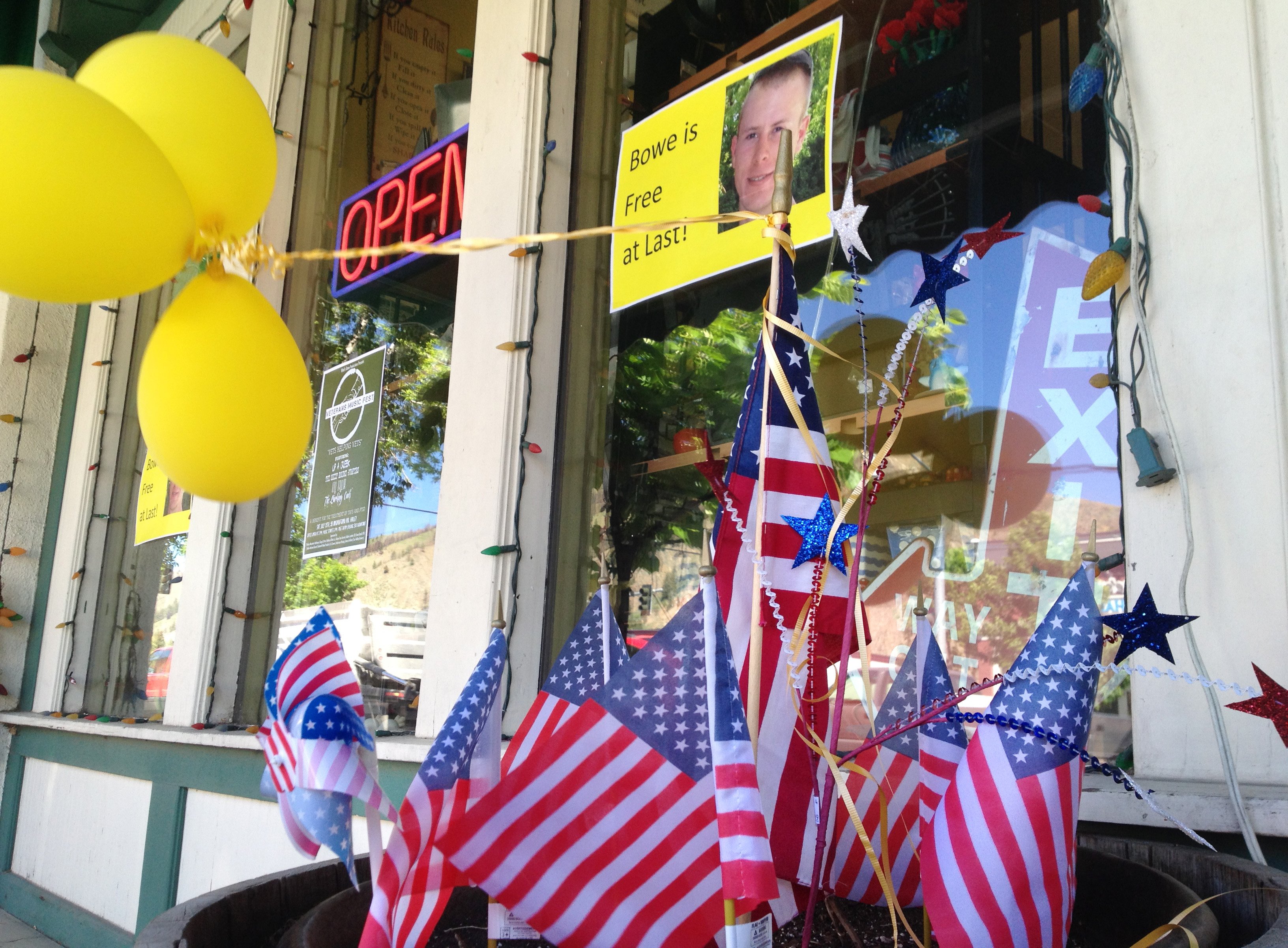 Flags and balloons, marking the release from captivity of Sgt. Bowe Bergdahl, adorn the sidewalk outside a shop in the soldier's hometown of Hailey, Idaho, on June 4, 2014. (Brian Skoloff—AP)