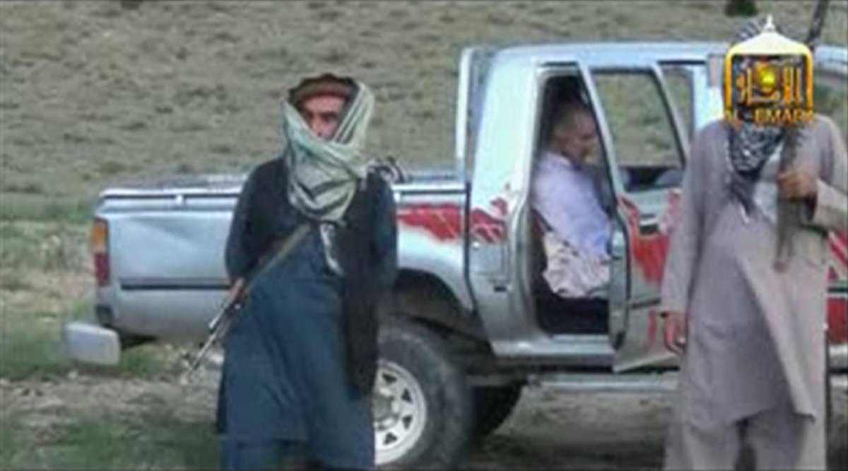 U.S. Army Sergeant Bowe Bergdahl (C) waits in a pick-up truck before he is freed at the Afghan border, in this still image from video released June 4, 2014. (Al-Emara/Reuters)