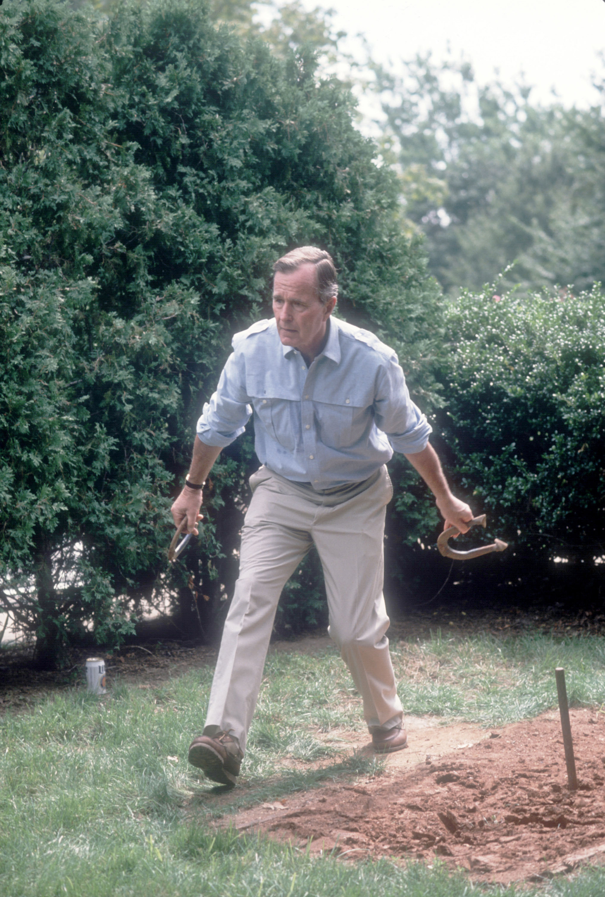 Vice President George H.W. Bush prepares to throw a horseshoe while on the campaign trail on September 3, 1988. Bush and his running mate Dan Quayle defeated Michael Dukakis in the Presidential election.