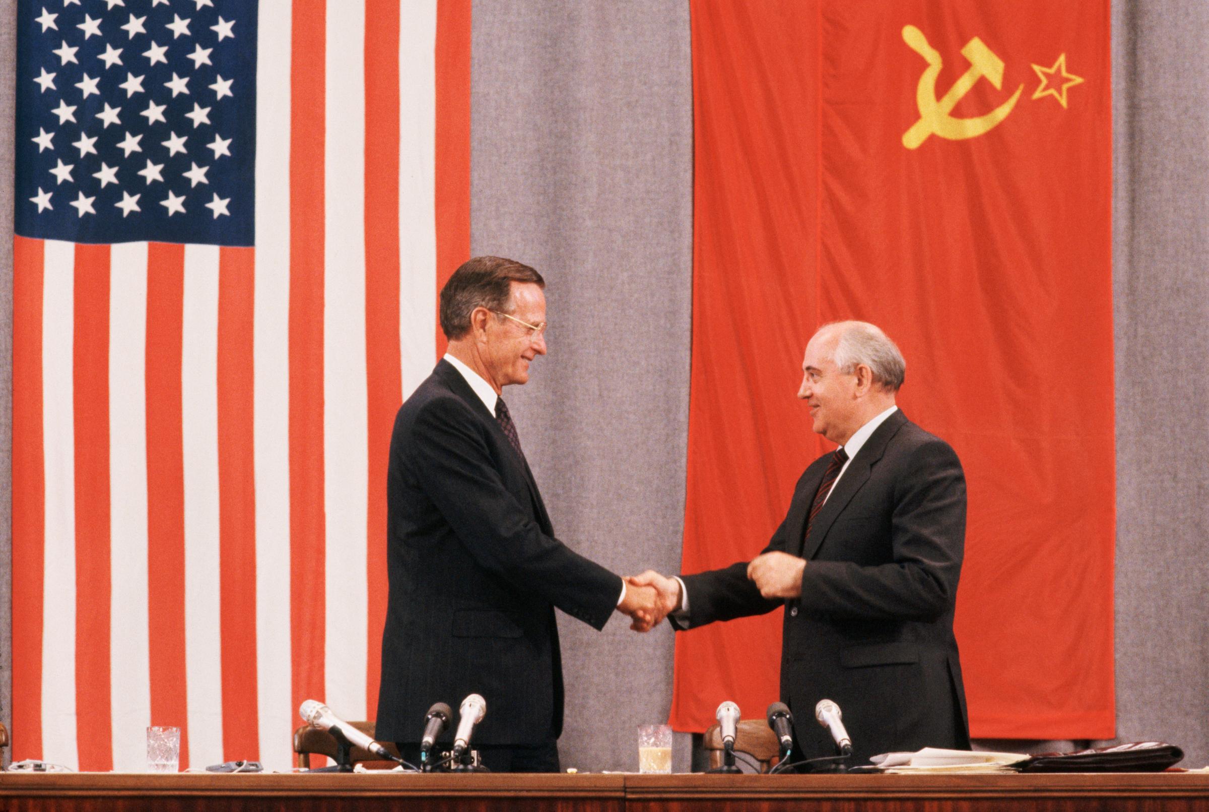 Presidents George H.W. Bush and Mikhail Gorbachev shake hands at the end of a press conference about the peace summit in Moscow on July 31, 1991.