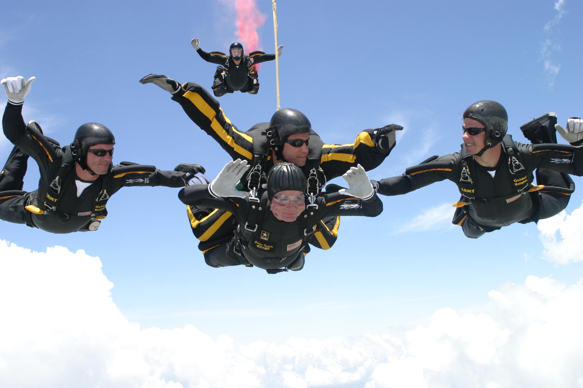 George H.W. Bush celebrates his 80th birthday with a tandem parachute jump over Texas A&amp;M University with the U.S. Army Golden Knights parachute team. on June 13, 2004 in College Station, Texas.