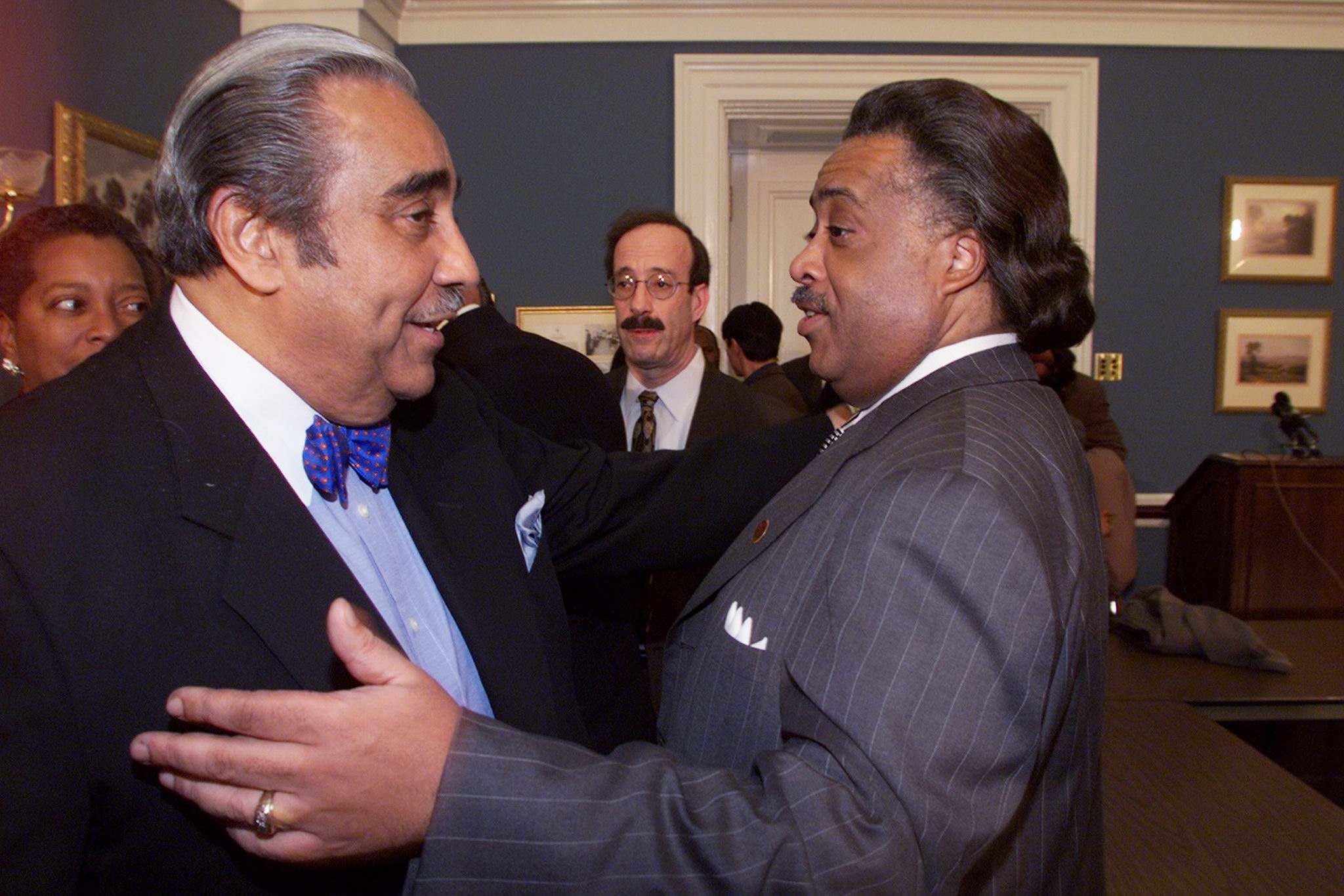 Rep. Charles Rangel talks with the Rev. Al Sharpton at a meeting of representatives of the Haitian community and members of Congress on March 29, 2000.