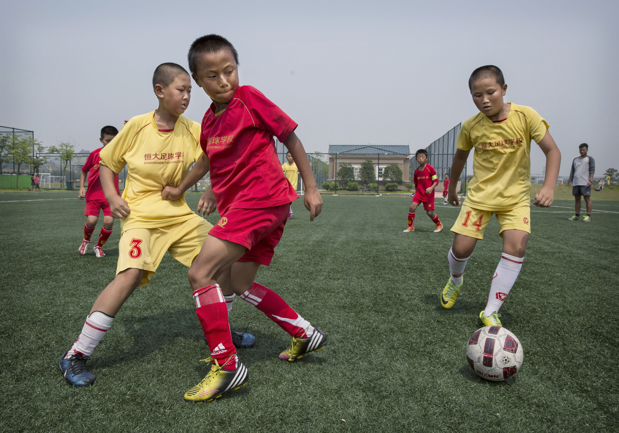 A match on a practice pitch at the Evergrande International Football School on June 14.