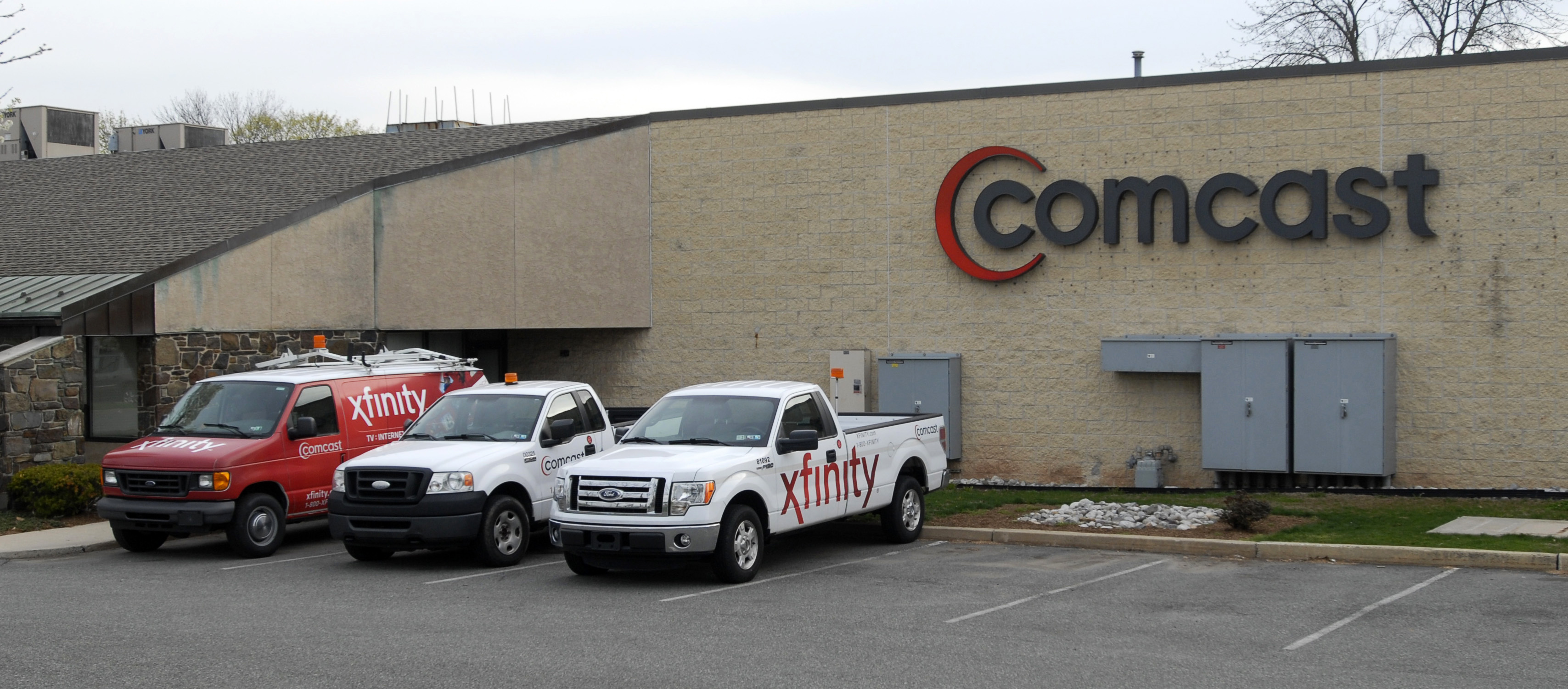 Vehicles with the Xfinity logo, a high-speed internet service offered by Comcast Corp., sit outside a Comcast facility in Pottstown, Pennsylvania, April 22, 2014. (Bradley C. Bower—Bloomberg/Getty Images)