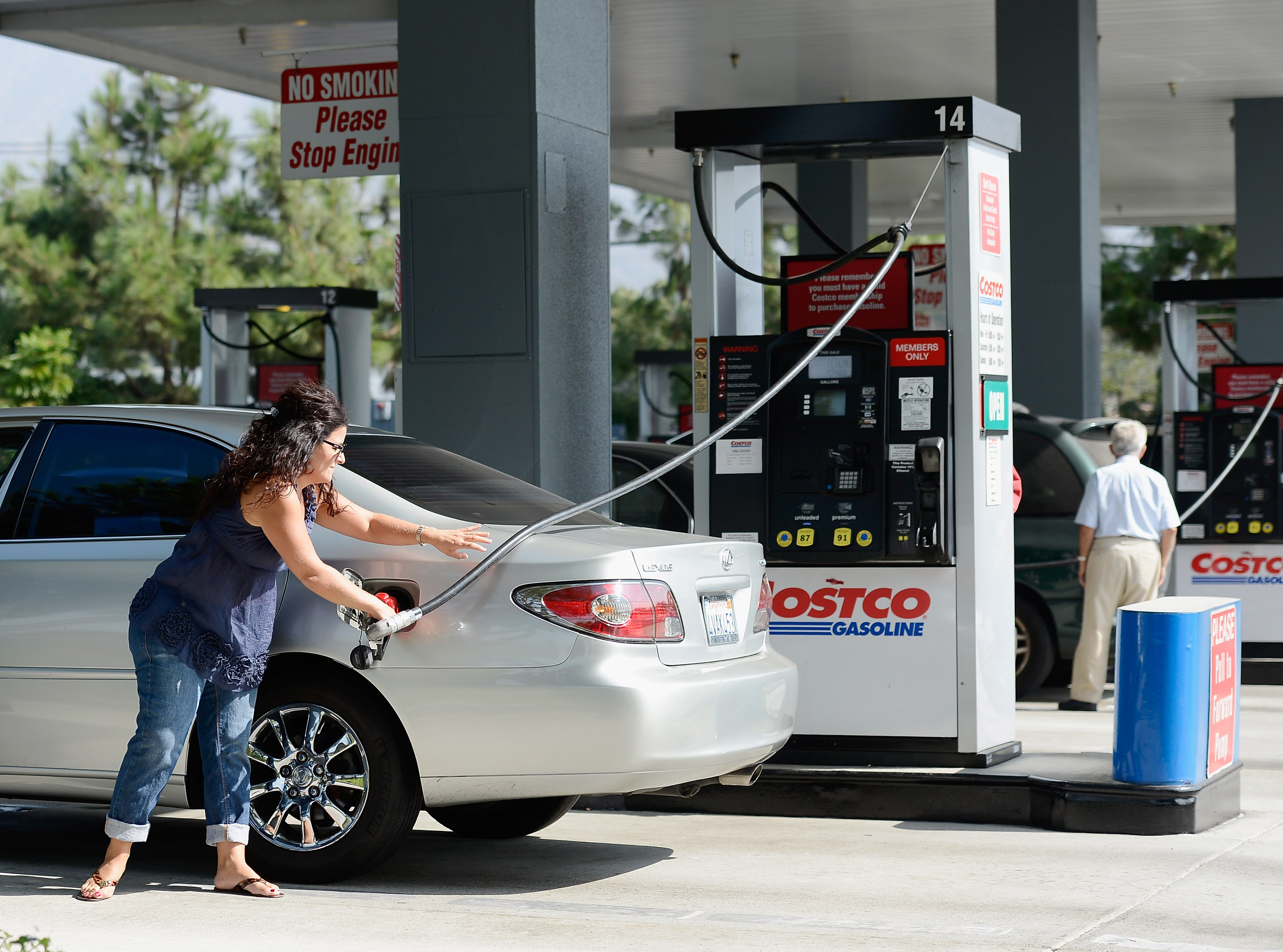 Customers gas up their car at Costco Wholesale Corp. on October 5, 2012 in Burbank, California. (Kevork Djansezian—Getty Images)
