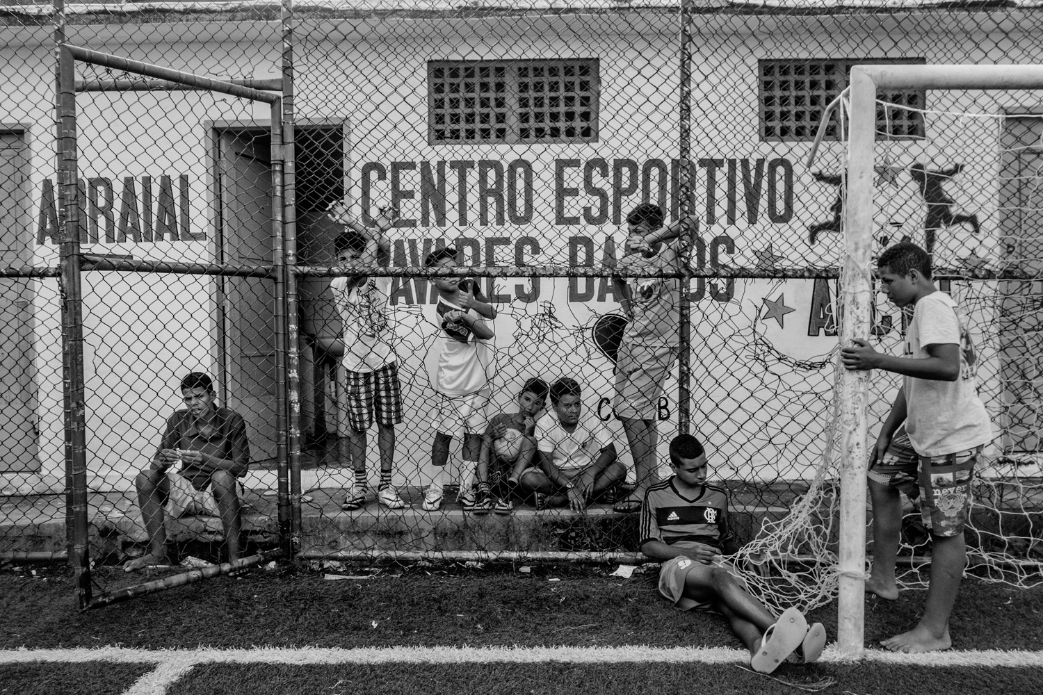 RIO DE JANEIRO, BRAZIL - JUNE 2014: Kids resting after a soccer training in the soccer school for favela kids in Tavares Bastos favela near Rio´s downtown. (Photo by Sebastián Liste/ Reportage by Getty Images)
