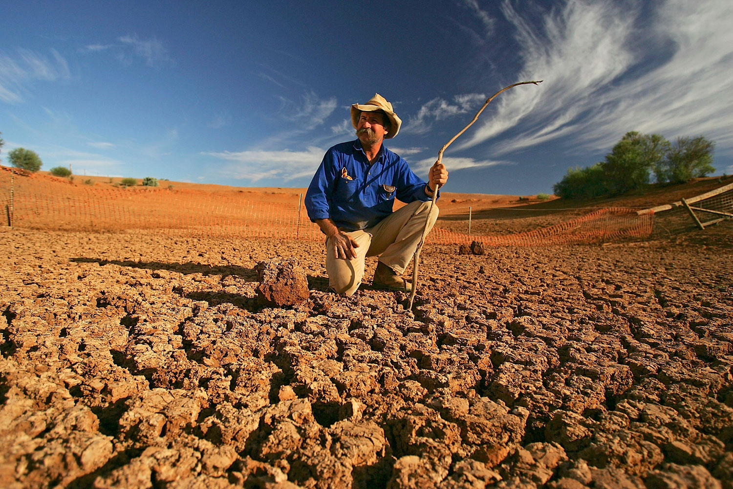 Stockman Gordon Litchfield surveys the bottom of a dry dam on his property on June 7, 2005 in Leigh Creek, Australia. Australia is enduring its worst drought in decades in part due to the increasing temperatures and the El Nino weather phenomenon.