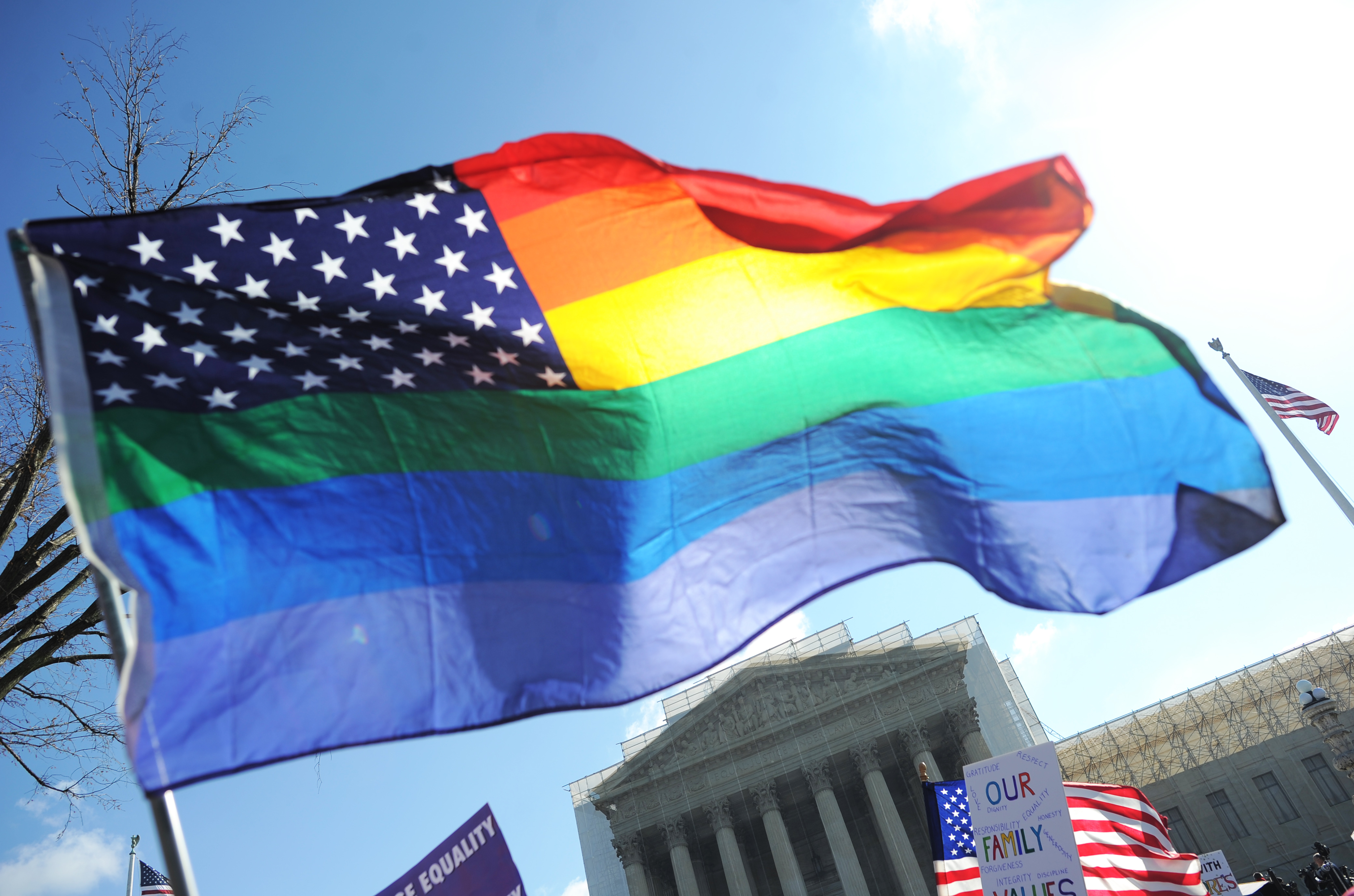 Same-sex marriage supporters wave a rainbow flag in front of the US Supreme Court on March 26, 2013 in Washington. (Jewel Samad—AFP/Getty Images)