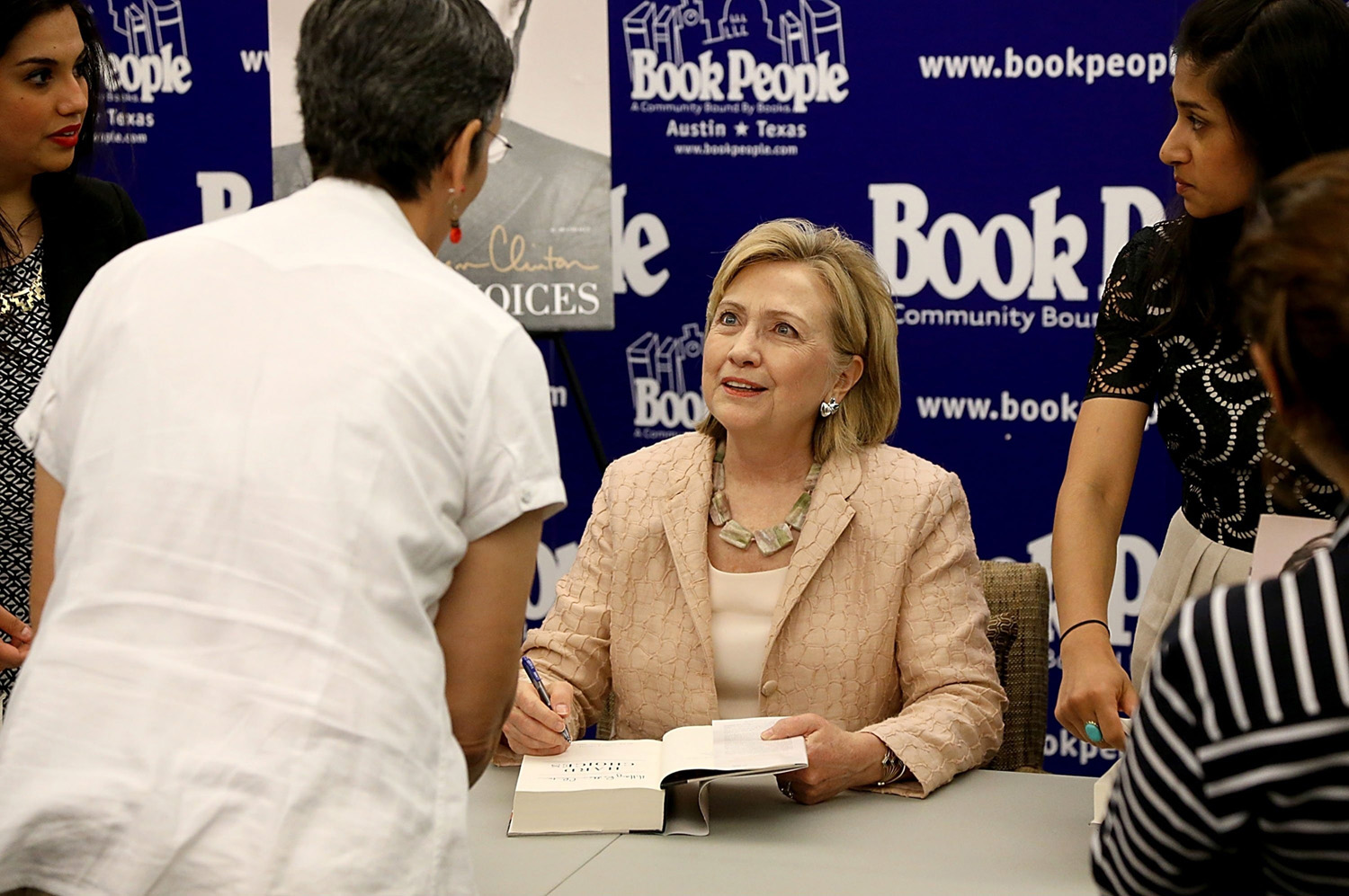 Former United States Secretary of State Hillary Rodham Clinton signs copies of her book 