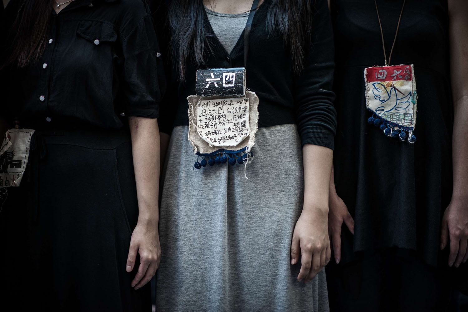 June 4, 2014. Students wear messages around their neck to commemorate China's 1989 Tiananmen Square events ahead of a candlelight vigil in Hong Kong.