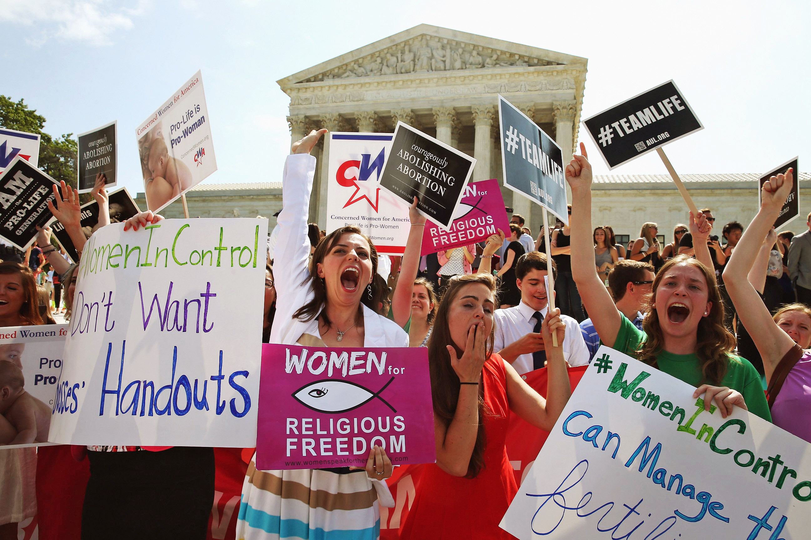 Hobby Lobby supporters react to the U.S. Supreme Court decision on June 30, 2014 in Washington, DC. (Mark Wilson—Getty Images)