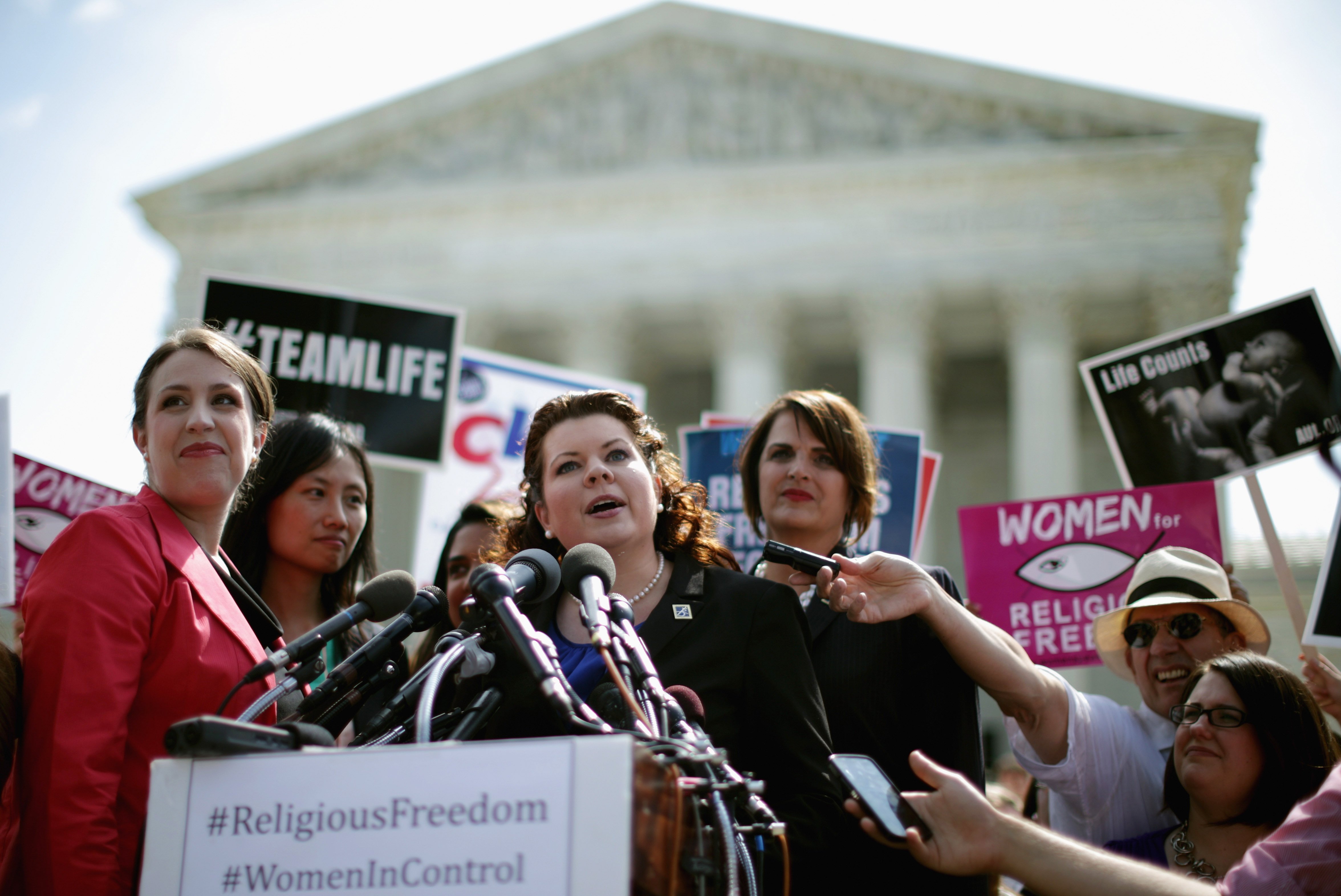 Lori Windham (C), senior counsel for The Becket Fund for Religious Liberty, addresses the news media in front of the Supreme Court after the decision in Burwell v. Hobby Lobby Stores June 30, 2014 in Washington. (Chip Somodevilla—Getty Images)