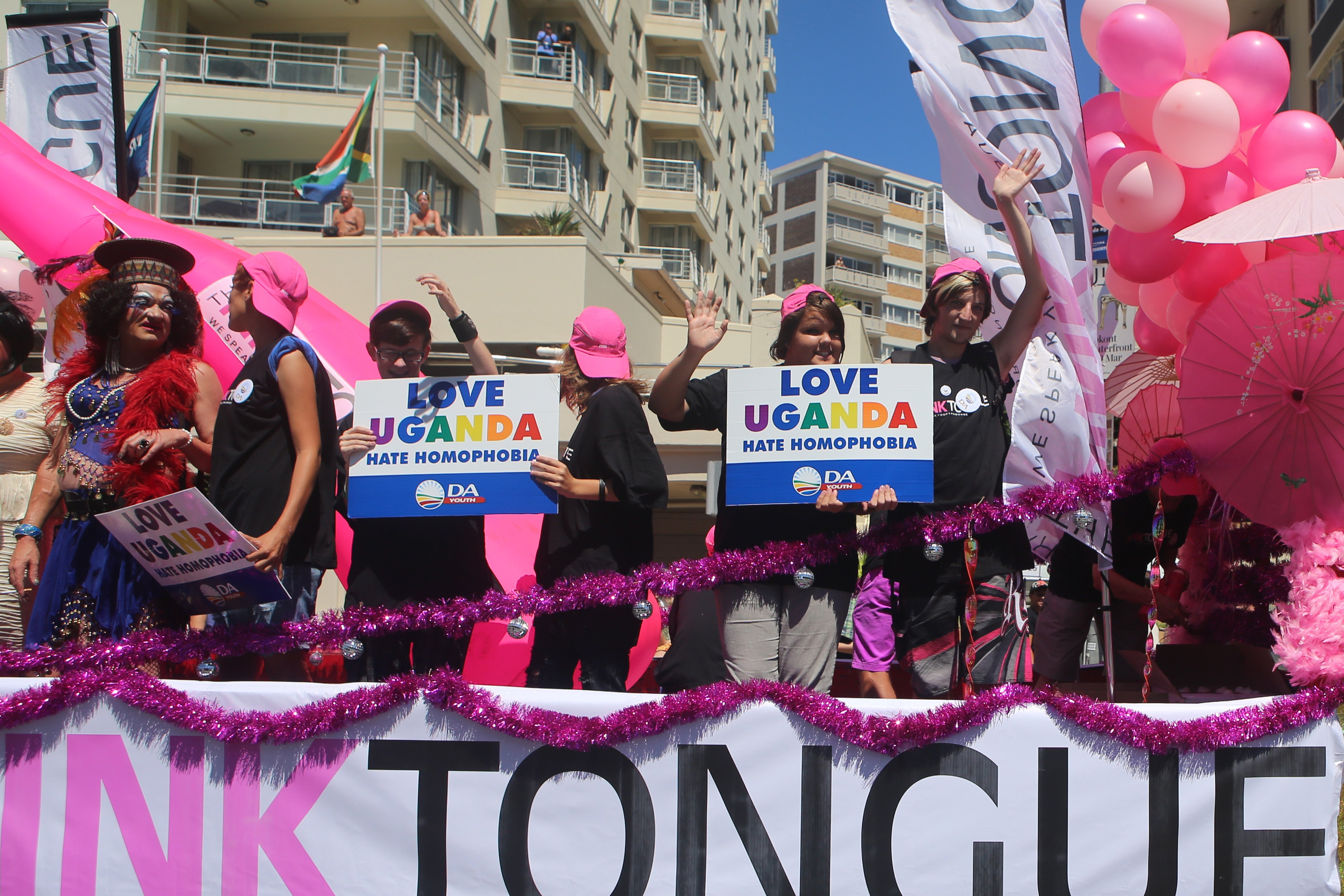 People stand on a float holding signs saying 'Love Uganda, hate homophobia' in reaction to Uganda's law banning homosexuality in Cape Town, South Africa, on March 1, 2014. (Jennifer Bruce—AFP/Getty Images)