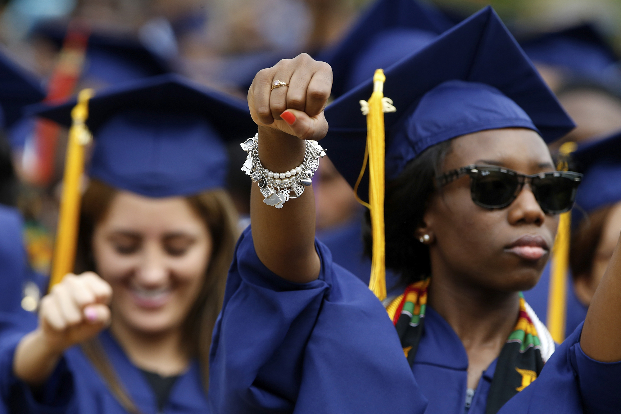 Graduates stand for the anthem "Lift Every Voice and Sing" during 2014 commencement ceremonies at Howard University in Washington May 10, 2014.