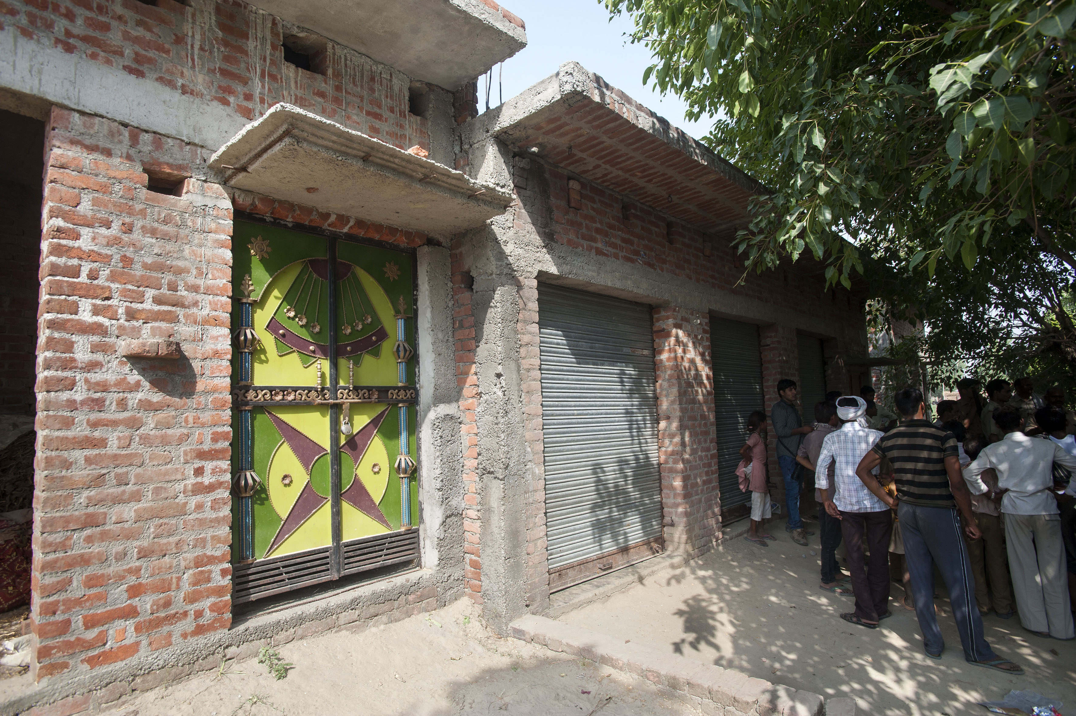 A view of the locked farmhouse of the three brothers (Avadesh, Urvesh and Pappu Yadav) accused in the rape and murder of two teenage girls in Katra Sadatganj village, Uttar Pradesh, India on May 30, 2014.