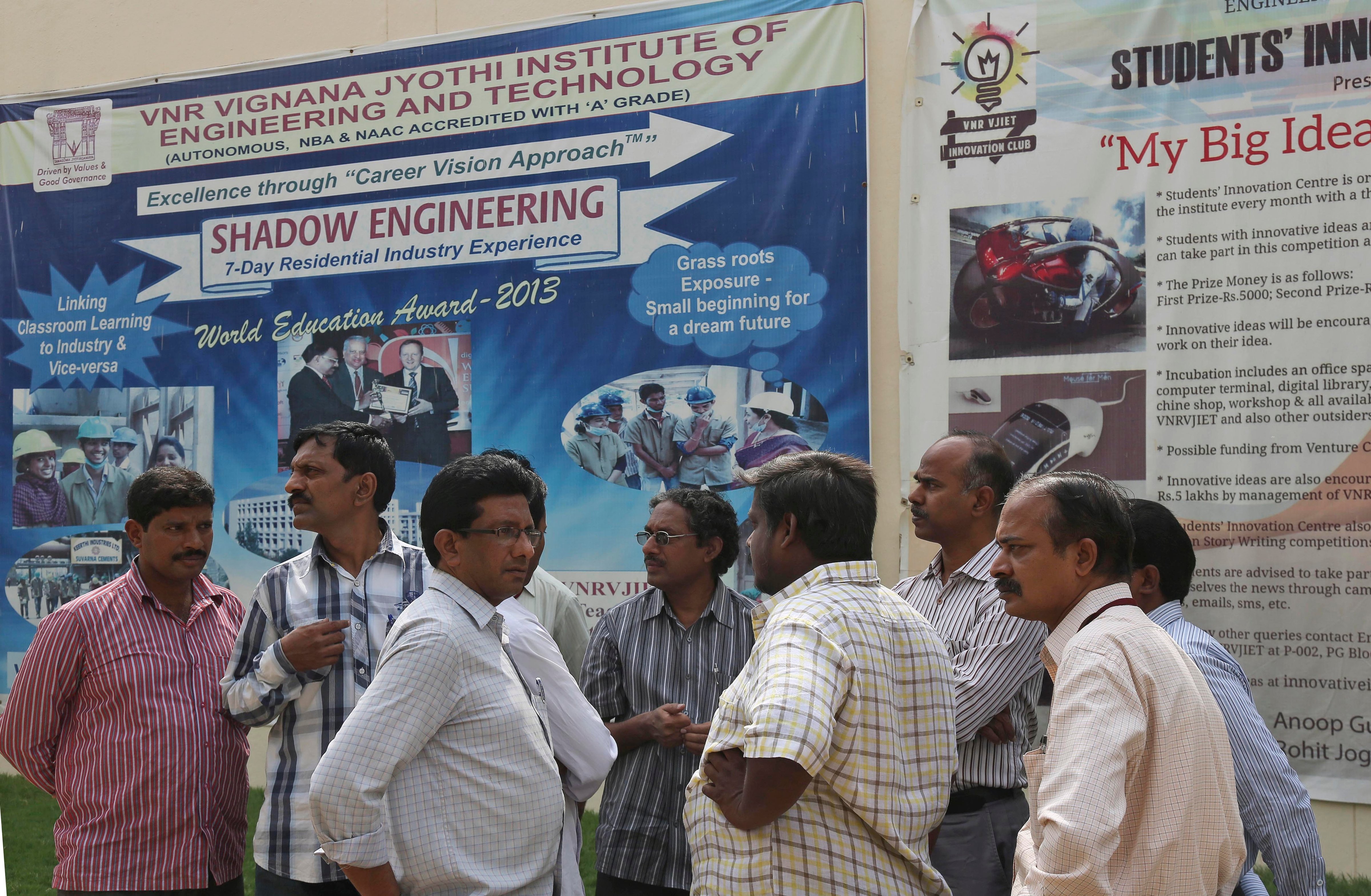 College staff working at VNR Vignana Jyothi Institute of Engineering and Technology gather on campus on the outskirts of Hyderabad, India, on June 9, 2014 (Mahesh Kumar —AP)