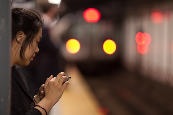 A woman uses her iPhone on a subway platform in New York City, where police have reported a drop in iPhone thefts. (Jens Schott Knudsen&amp;mdash;flickr Editorial/Getty Images)