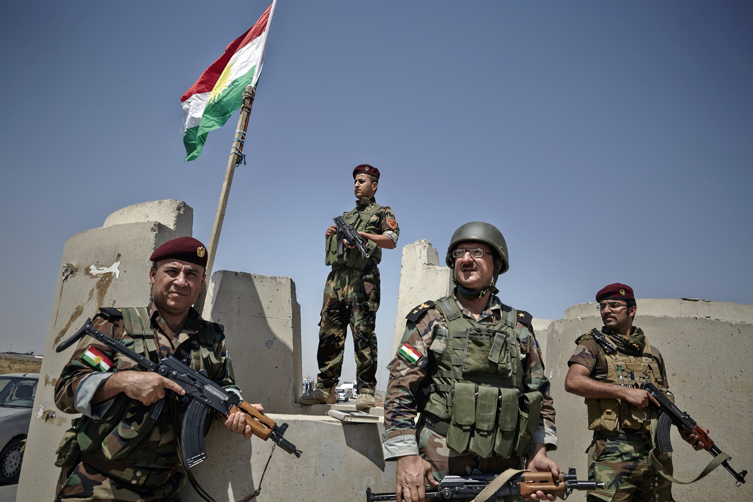 Kurdish Peshmerga fighters provide security at the last checkpoint outside of Mosul on June 14. (Sebastiano Tomada—Getty Images)