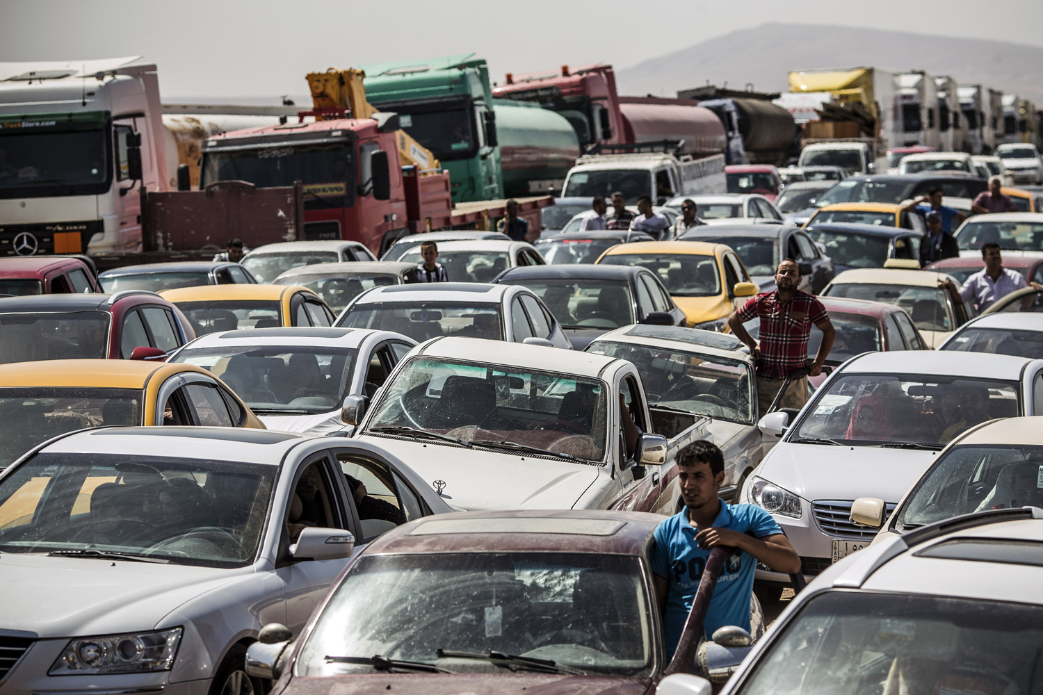 Traffic from Mosul queues at a Kurdish Check point on June 14,in Kalak.