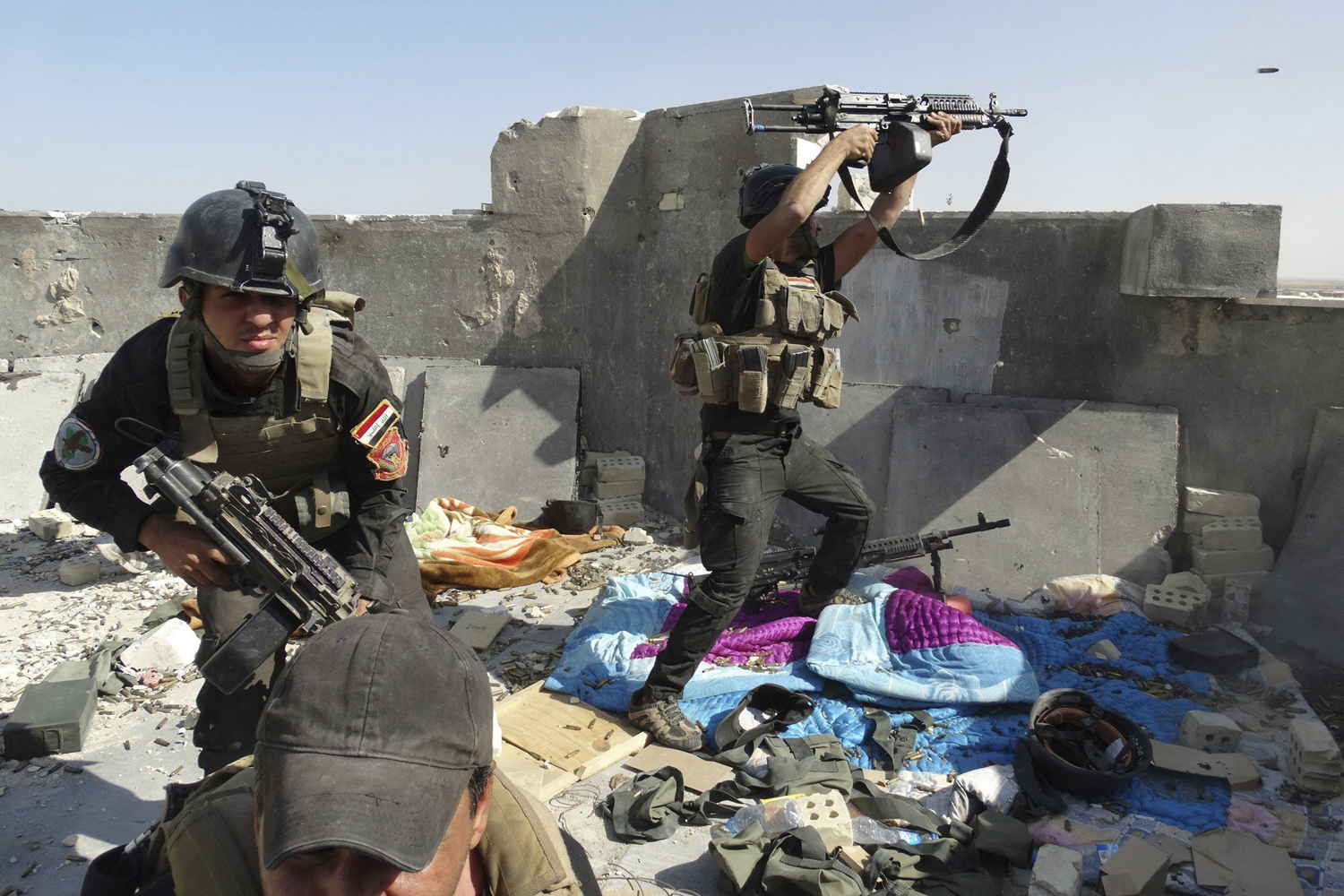 Members of the Iraqi Special Operations Forces take their positions during clashes with the al Qaeda-linked Islamic State of Iraq and the Syria  (ISIS) in the city of Ramadi,  June 19.