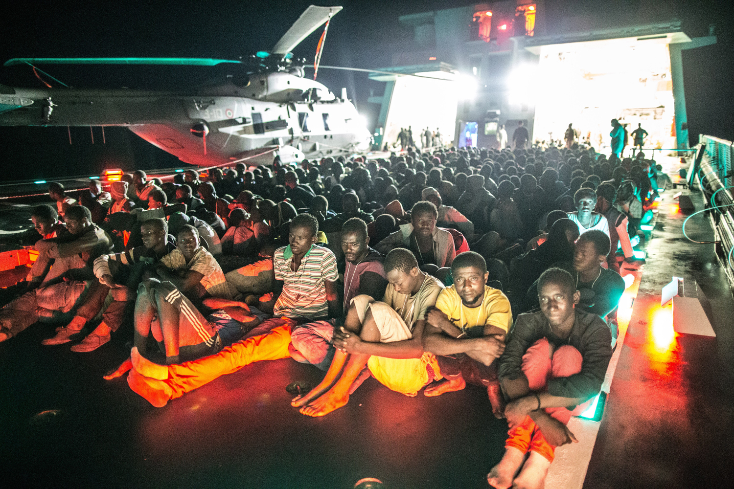 African asylum seekers rescued off boats and taken aboard an Italian navy ship, June 8.