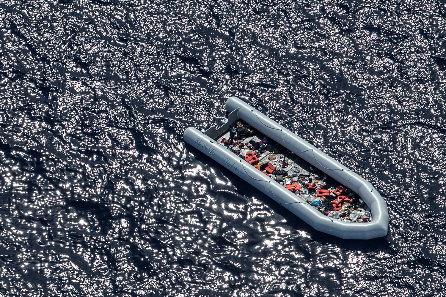 An empty dinghy with leftover lifesavers after the Italian navy rescued asylum seekers off the coast of Africa, June 7, 2014.