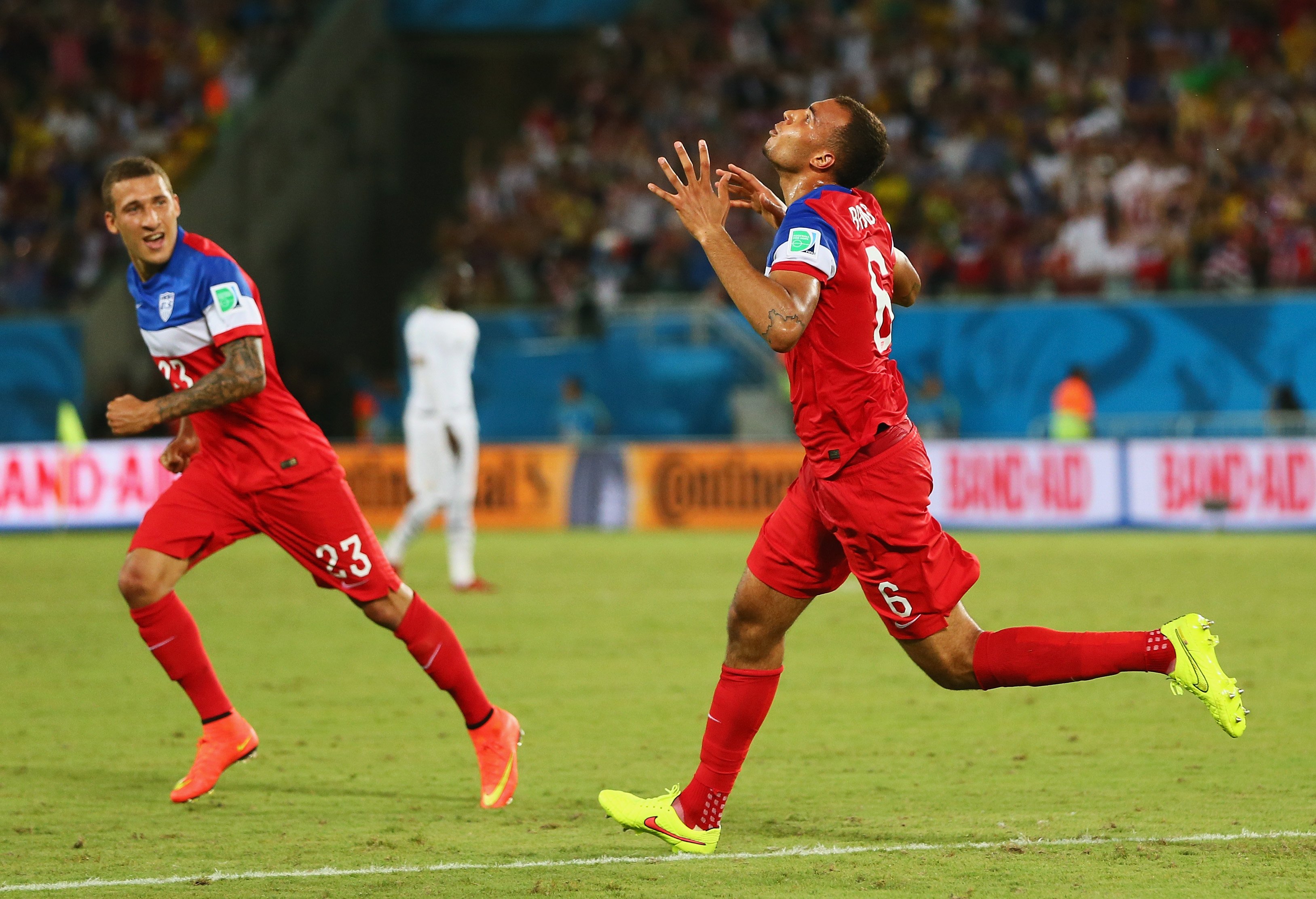 From right: John Brooks of the United States celebrates scoring his team's second goal with Fabian Johnson during the 2014 FIFA World Cup Brazil Group G match between Ghana and the United States at Estadio das Dunas on June 16, 2014 in Natal, Brazil. (Kevin C. Cox—Getty Images)