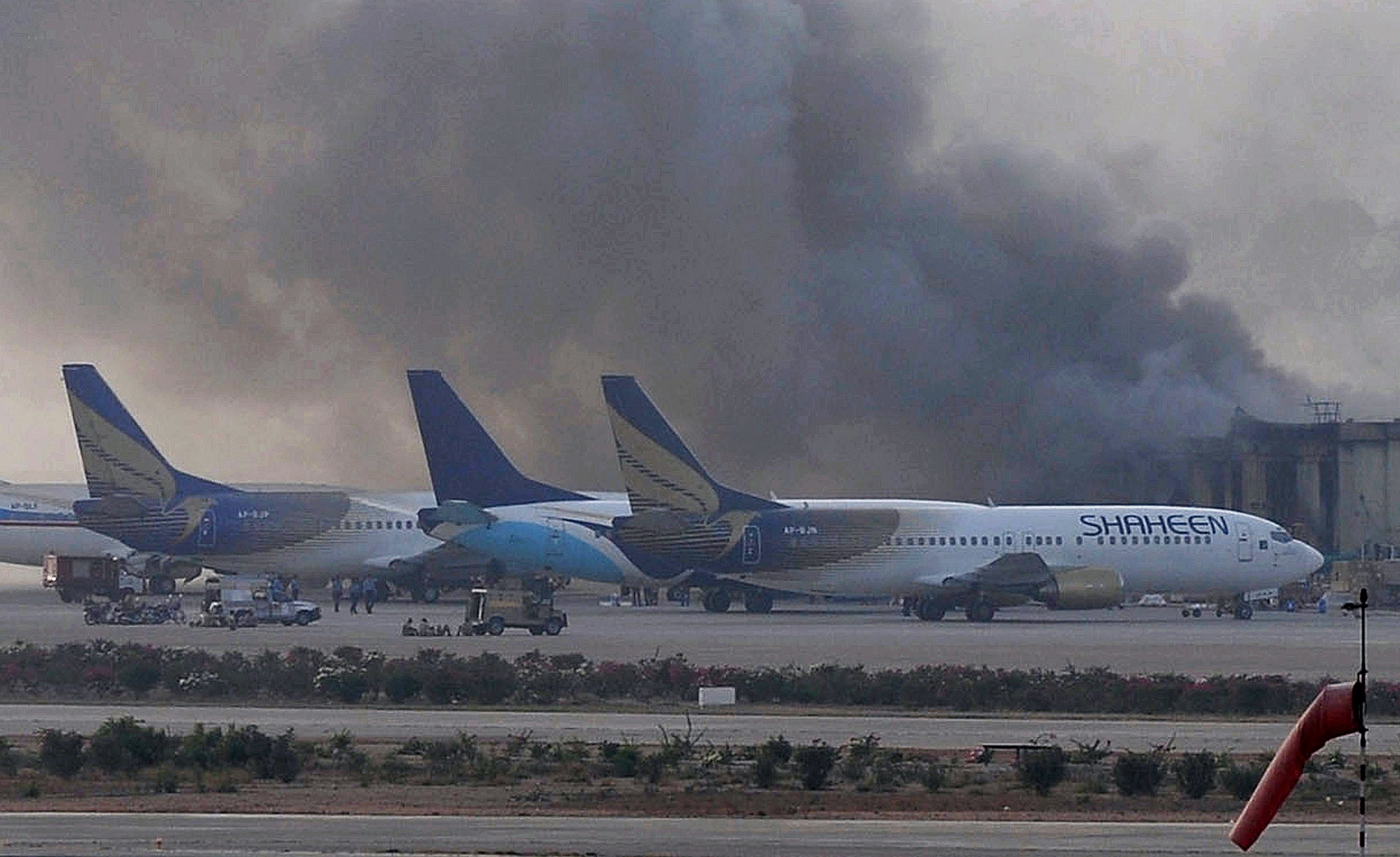 Smoke rises after militants launched an early morning assault at Jinnah International Airport in Karachi, Pakistan on June 9, 2014. (Rizwan Tabassum—AFP/Getty Images)