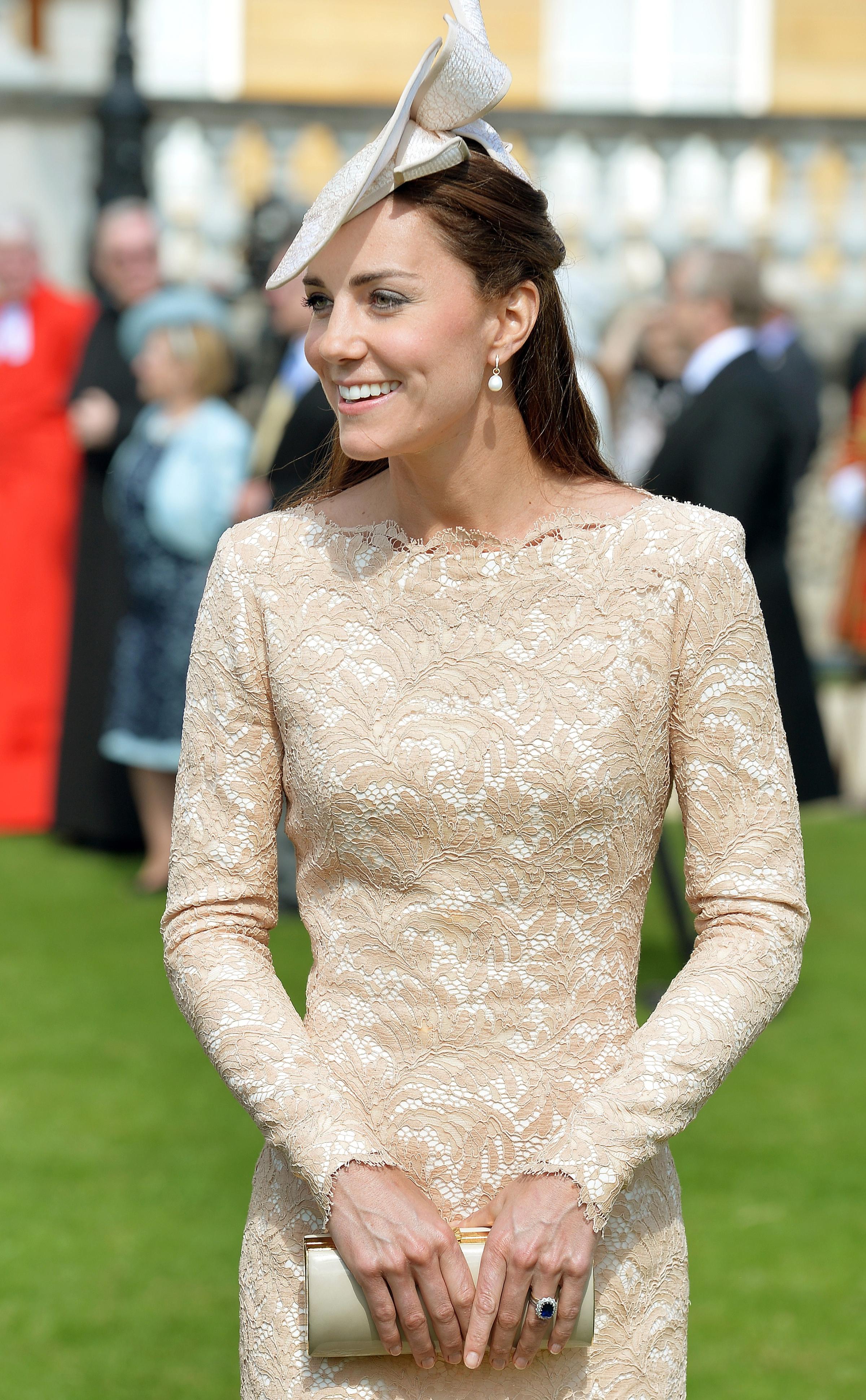 Britain's Catherine, Duchess of Cambridge, attends a garden party at Buckingham Palace in London on June 10, 2014.