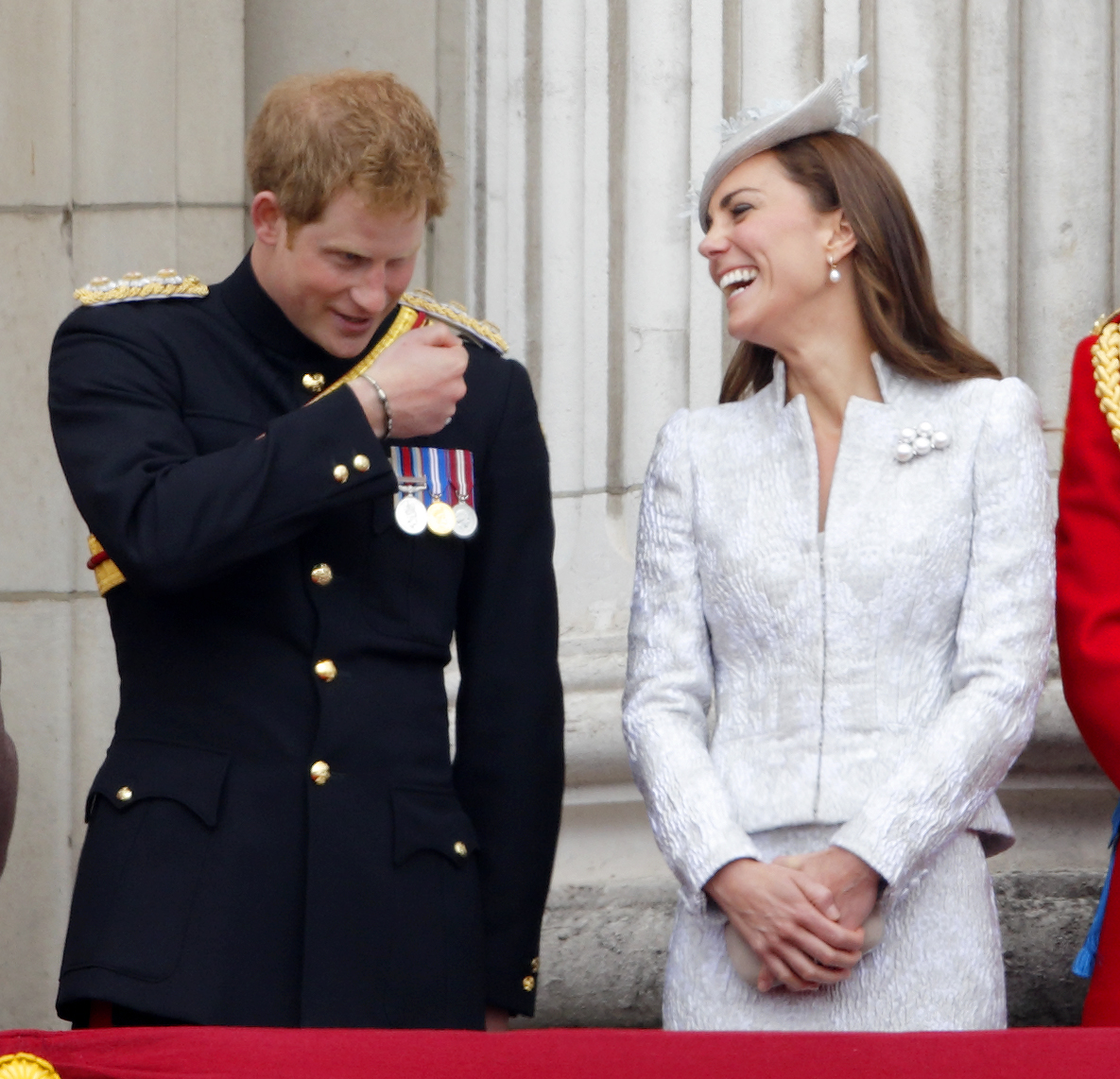 Prince Harry and Catherine, Duchess of Cambridge watch the fly-past from the balcony of Buckingham Palace during Trooping the Colour, Queen Elizabeth II's Birthday Parade on June 14, 2014 in London.