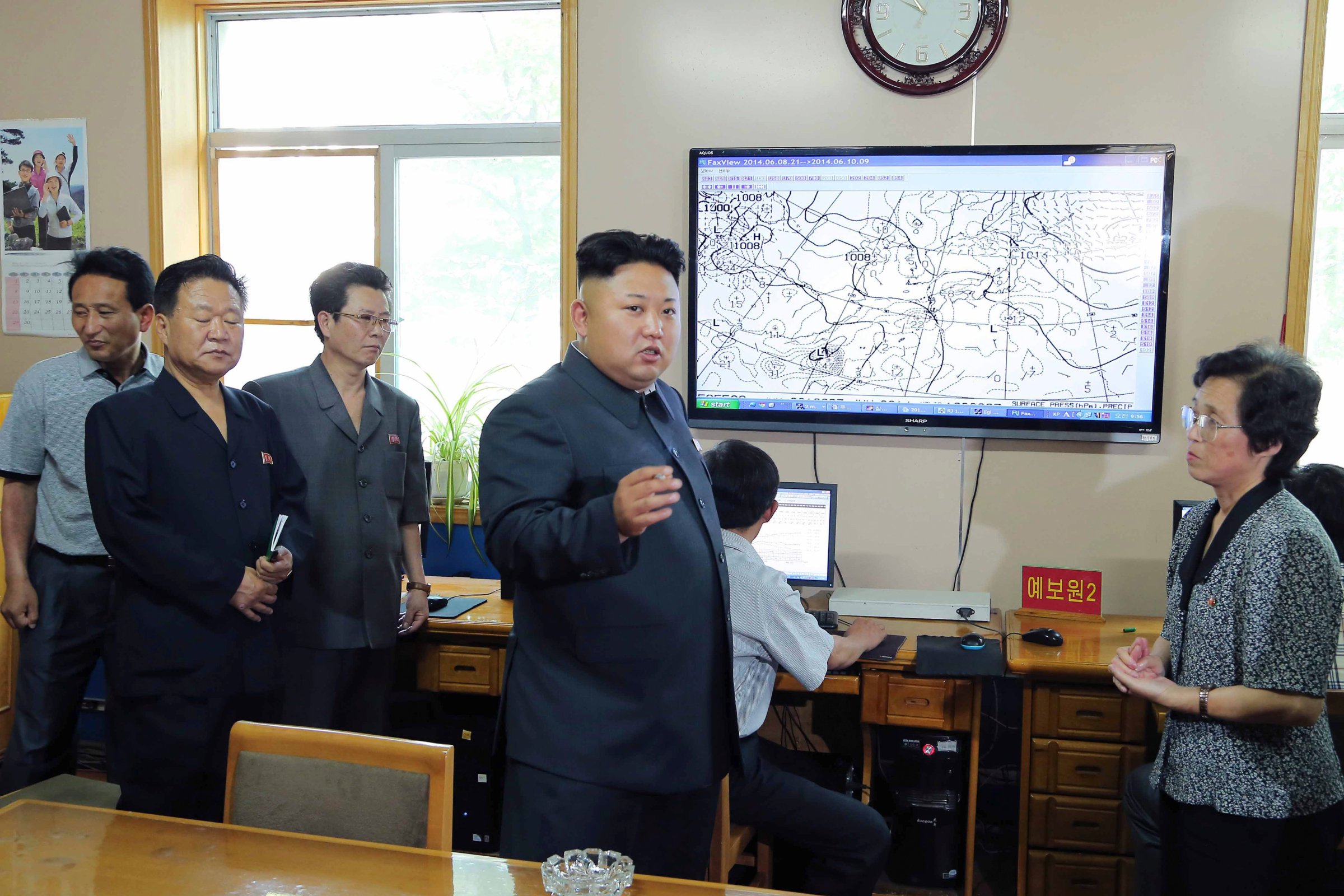 North Korean leader Kim Jong Un gives field guidance to the Hydro-meteorological Service in this undated photo released by North Korea's KCNA in Pyongyang