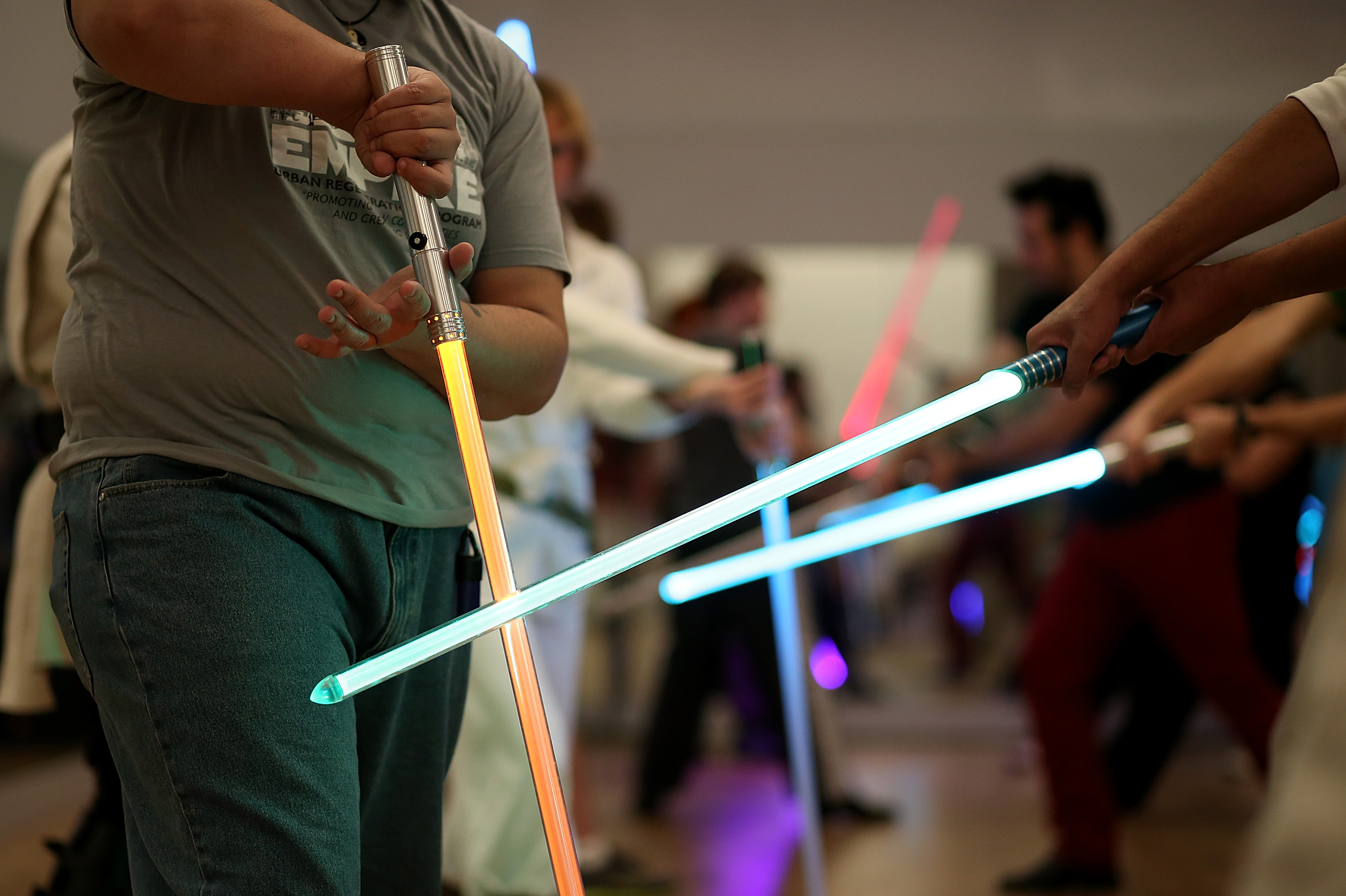 Students perform combat moves using lightsabers during a Golden Gate Knights class in saber choreography on February 24, 2013 in San Francisco. (Justin Sullivan—Getty Images)