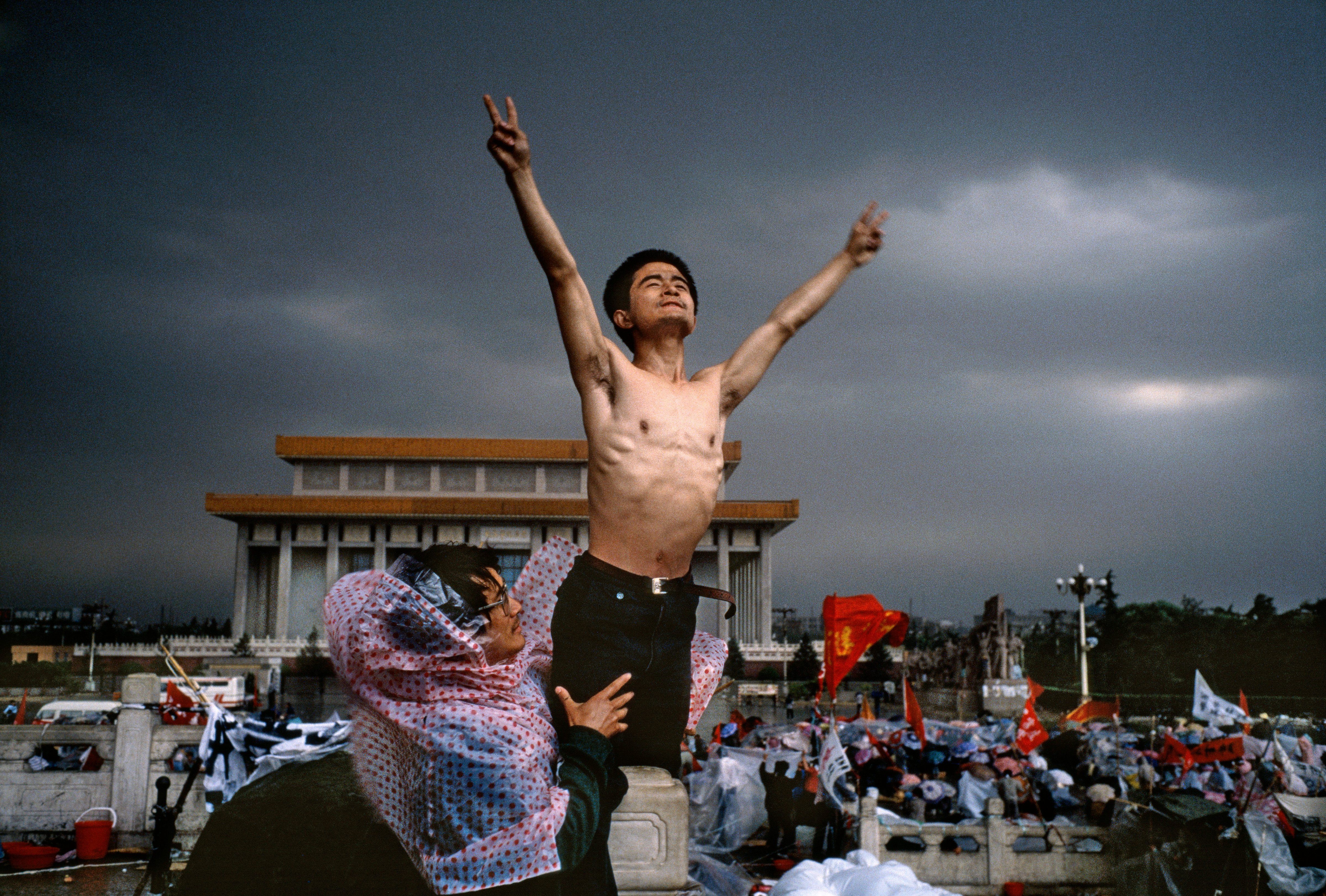 A man flashes the symbol for peace in Tiananmen Square, in Beijing, in 1989 (Stuart Franklin—Magnum)