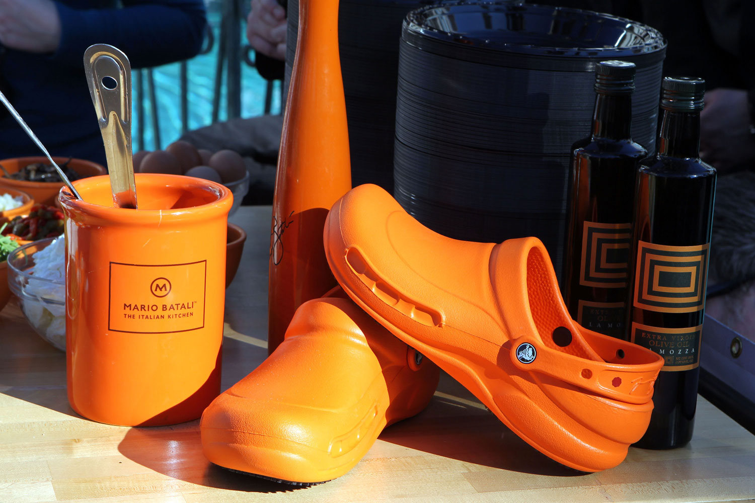 Chef Mario Batali's signature cookware and Crocs shoes are presented on the prep table during a cooking demonstration at the "Winter In Venice" at The Venetian on November 25, 2011 in Las Vegas, Nevada.