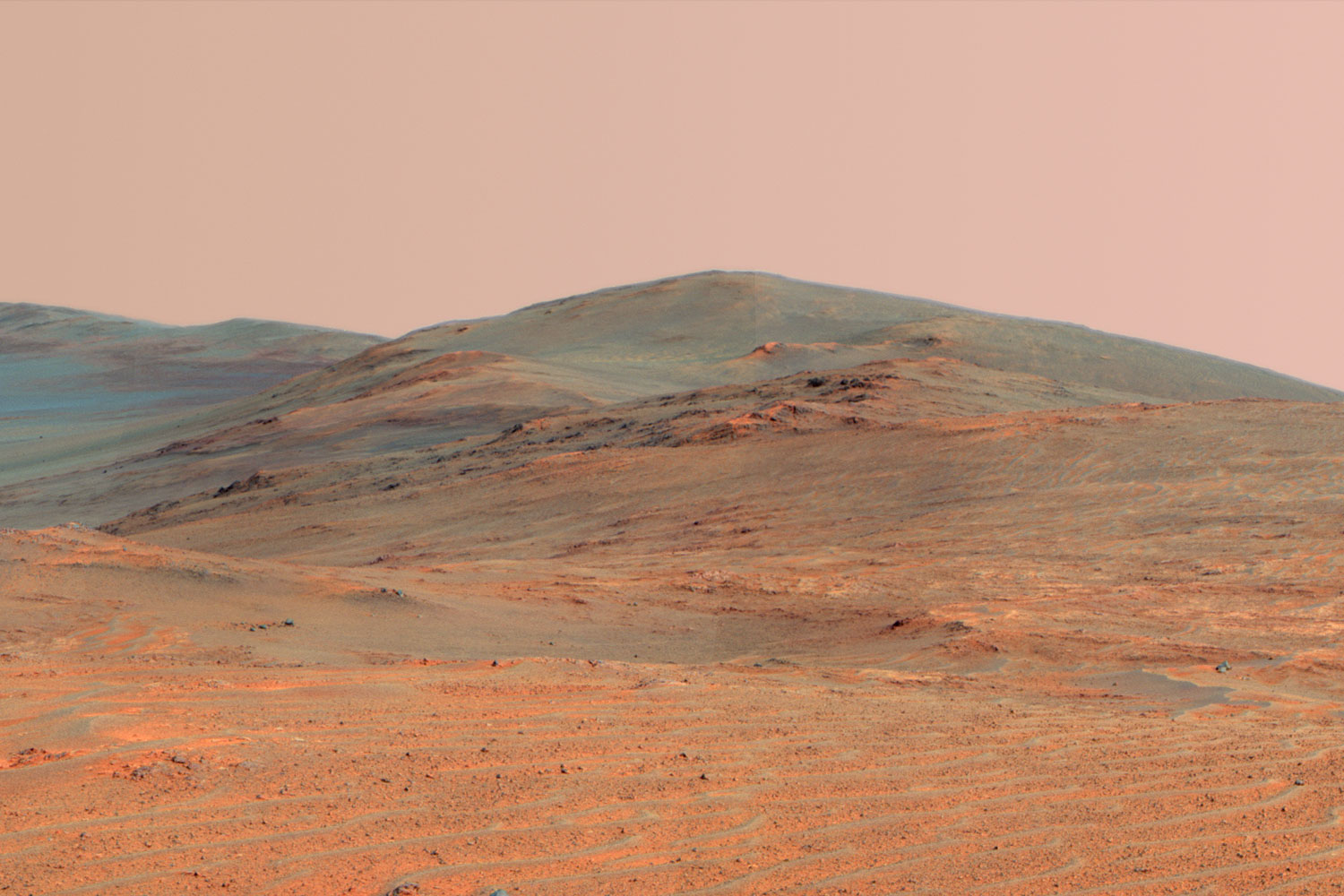 This vista of the Endeavour Crater rim taken by Opportunity Rover combines several exposures taken by the rover's panoramic camera (Pancam) on the 3,637th Martian day, or sol, of the mission on April 18, 2014 and was released on May 19, 2014.