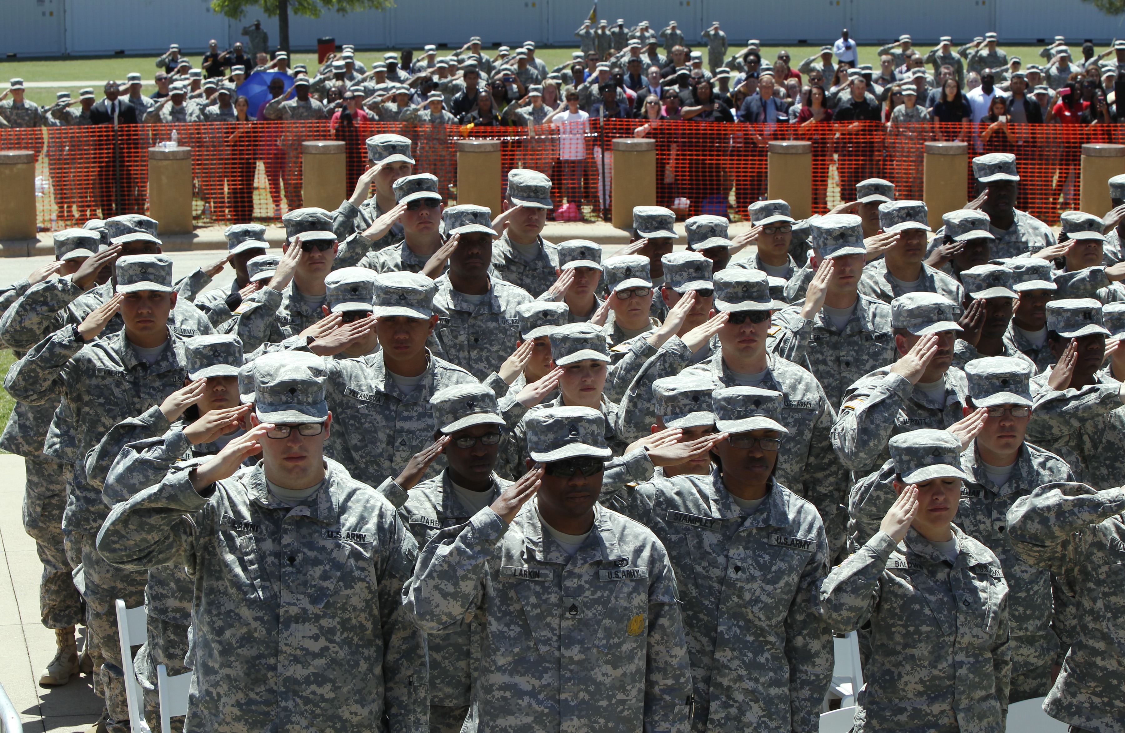 U.S. Army soldiers salute during the national anthem at Fort Hood military base in Killen, Texas on April 9, 2014. (Erich Schlegel—Getty Images)