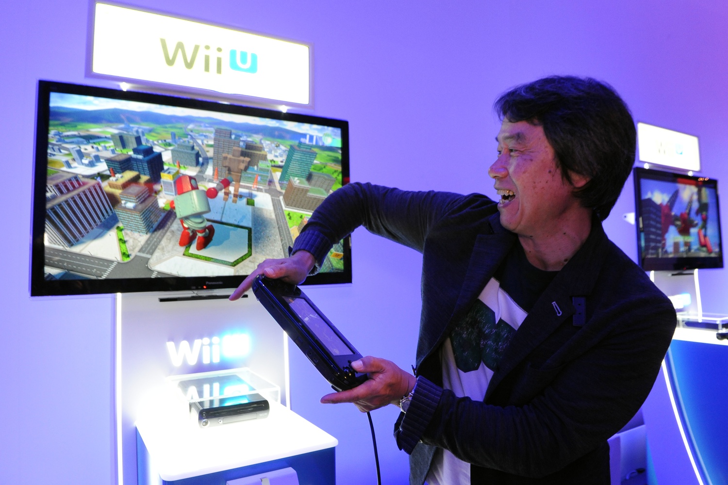 Shigeru Miyamoto plays Project Giant Robot, using the GamePad's motion control sensors to move the robot's torso. (Nintendo)
