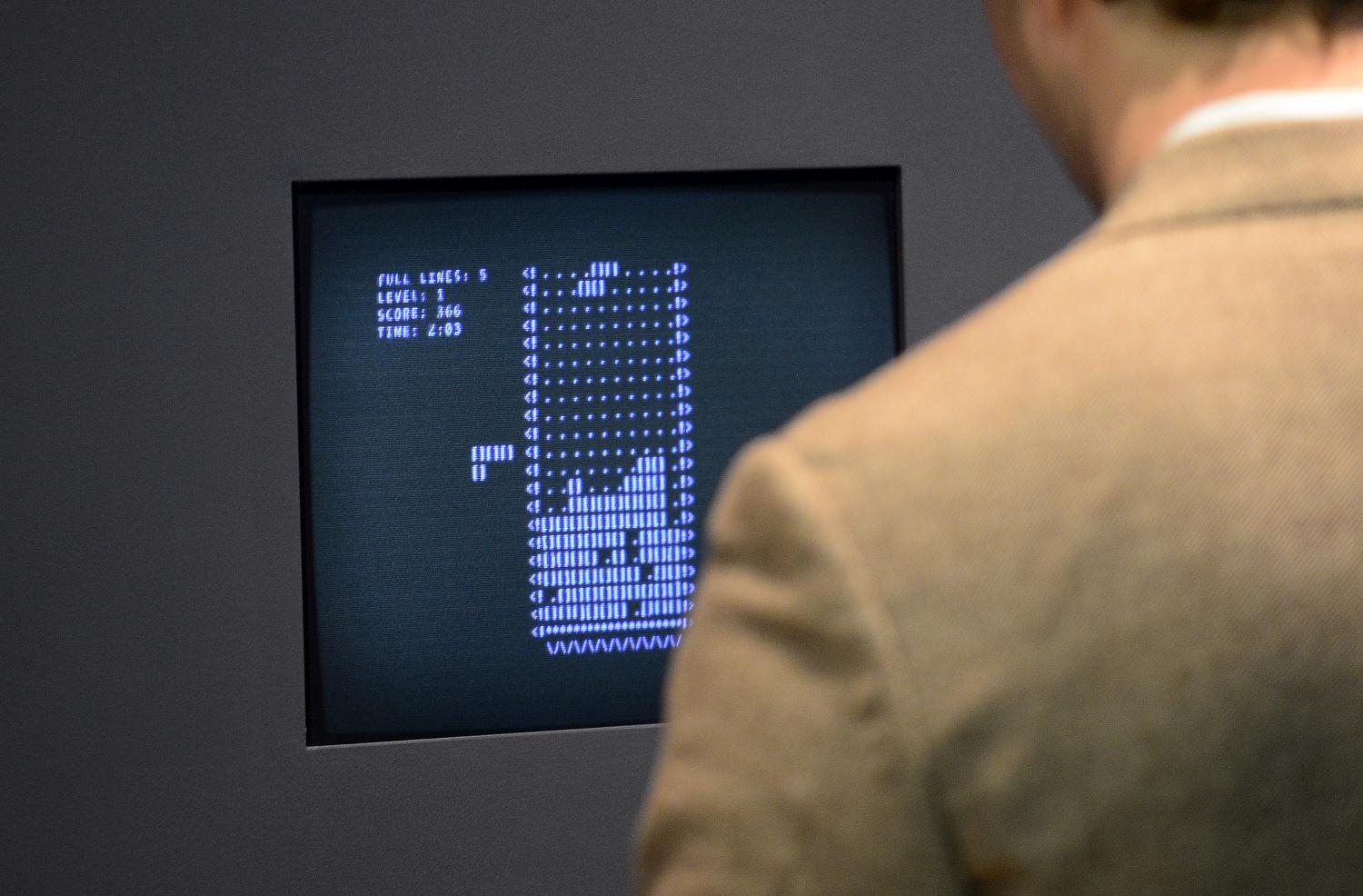 A visitor plays Tetris during an exhibition preview featuring 14 video games acquired by The Museum of Modern Art (MoMA) in New York, March 1, 2013 (Emmanuel Dunand -- AFP / Getty Images)
