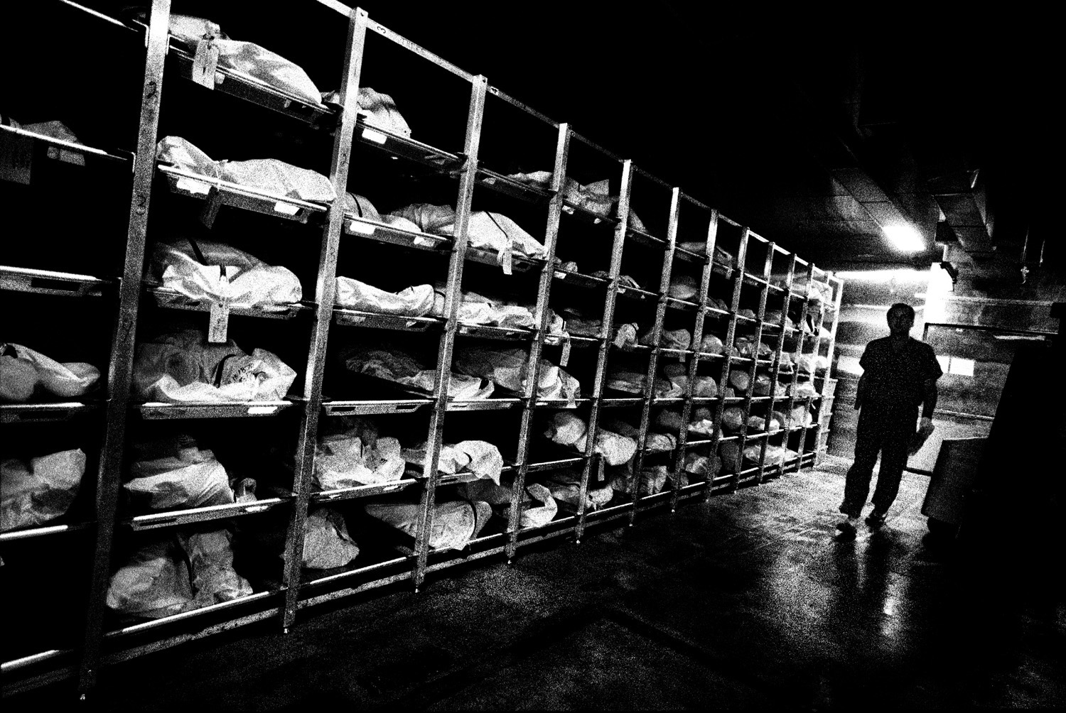 Tucson, Ariz. | 
                              July 30, 2013
                              
                              At the Pima County Office of the Medical Examiner, the remains of migrants found near the border are inspected and stored.