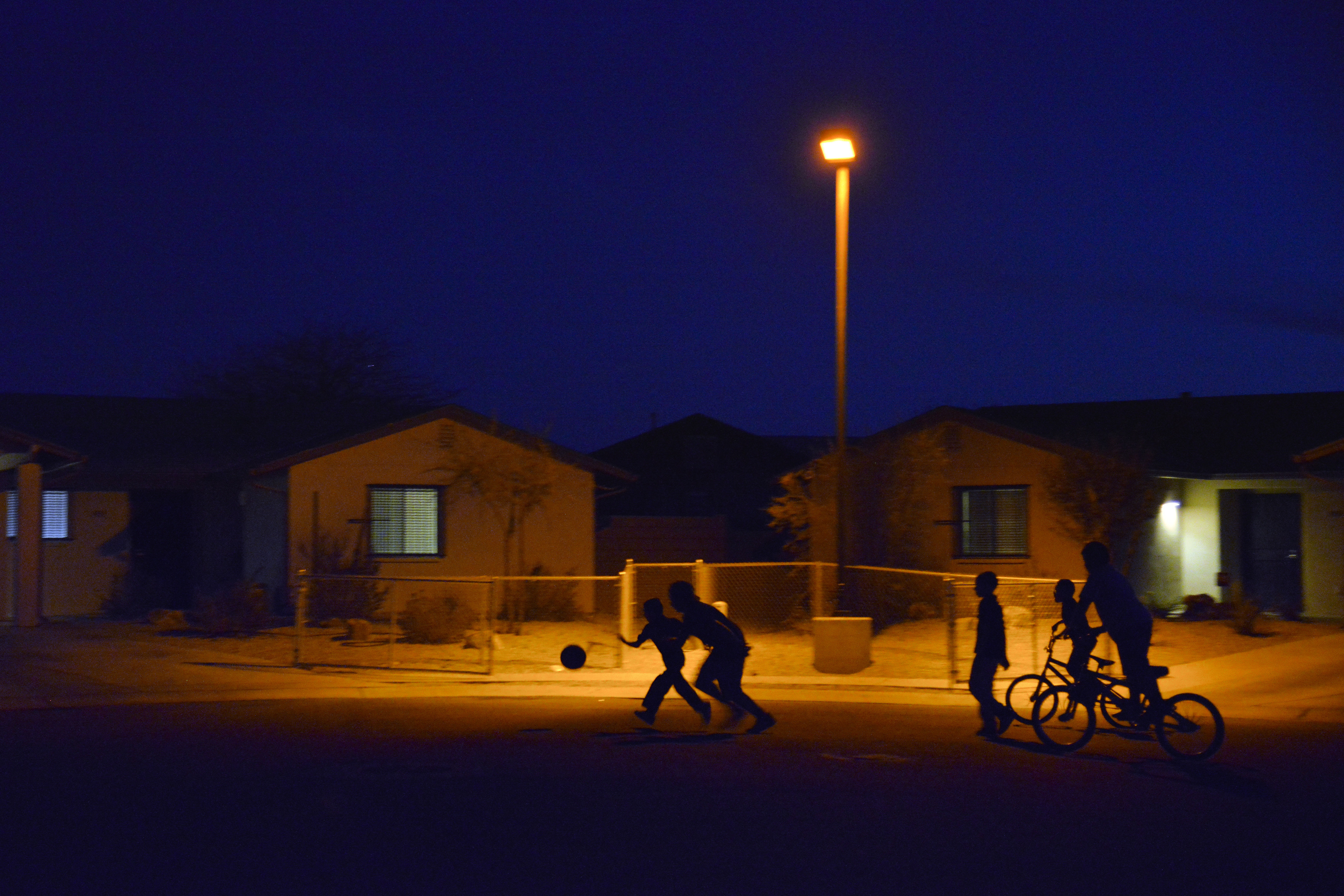 Kids play in the street on the Pascua Yaqui Indian Reservation, Ariz. on March 18, 2014.