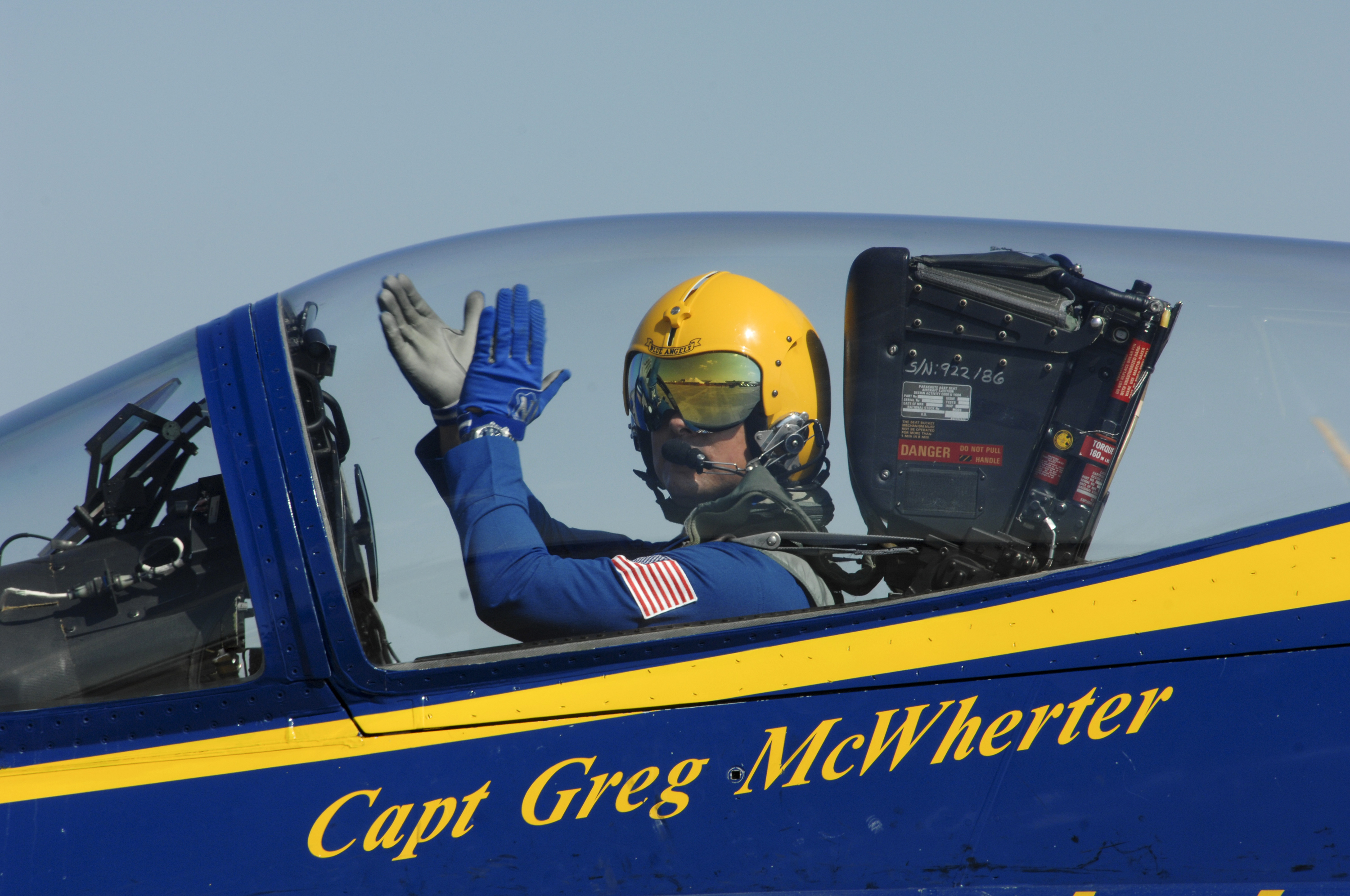 Capt. Greg McWherter, commanding officer and flight leader of the U.S. Navy flight demonstration squadron, the Blue Angels, responds to the crowd at the Guardians of Freedom Air Show in Lincoln, Neb., Sept. 10, 2011. (Jen Blake—U.S. Navy/AP)