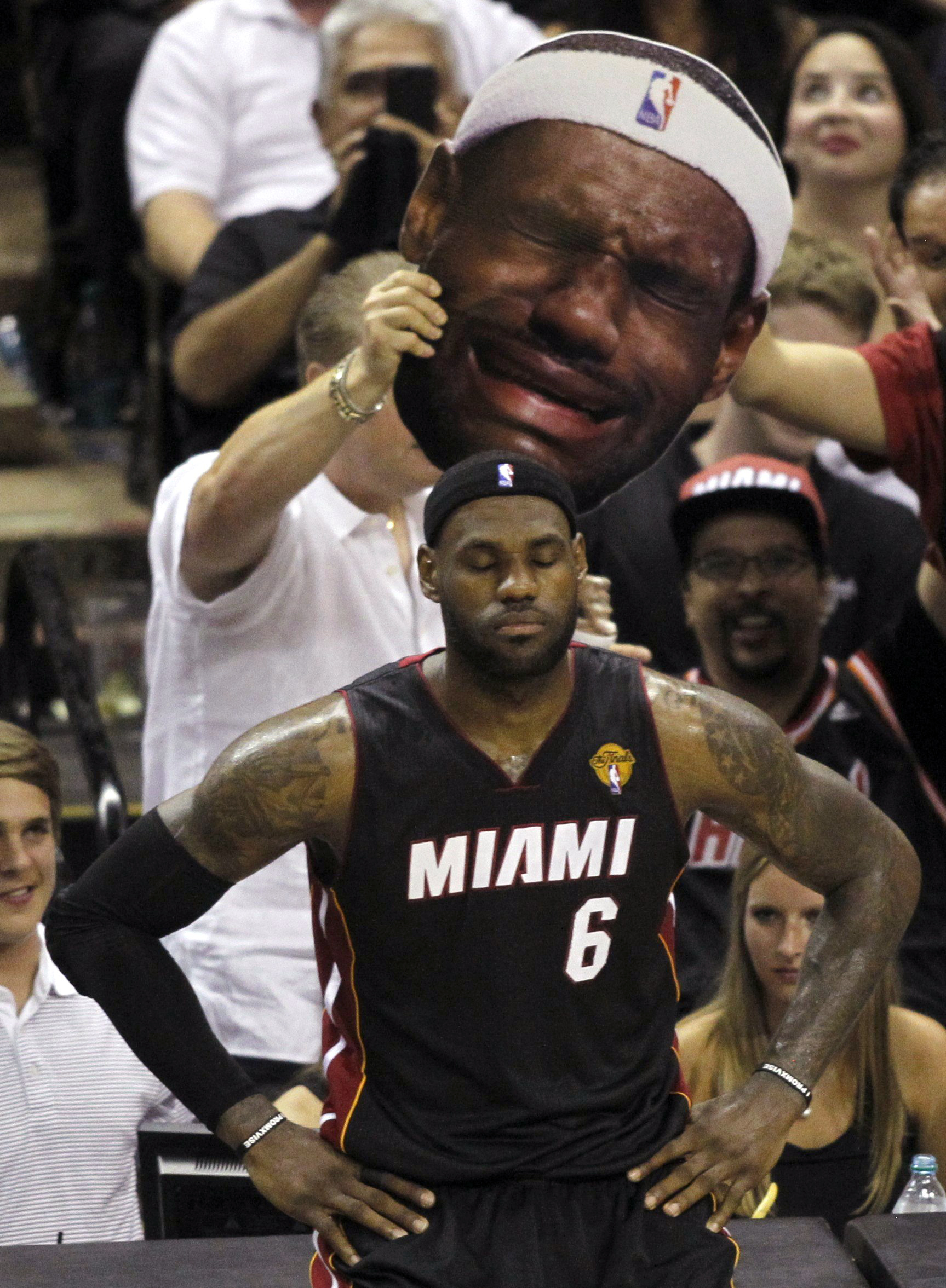 San Antonio Spurs fans taunt Miami Heat's LeBron James during the third quarter in Game 2 of their NBA Finals basketball series in San Antonio on June 8, 2014.