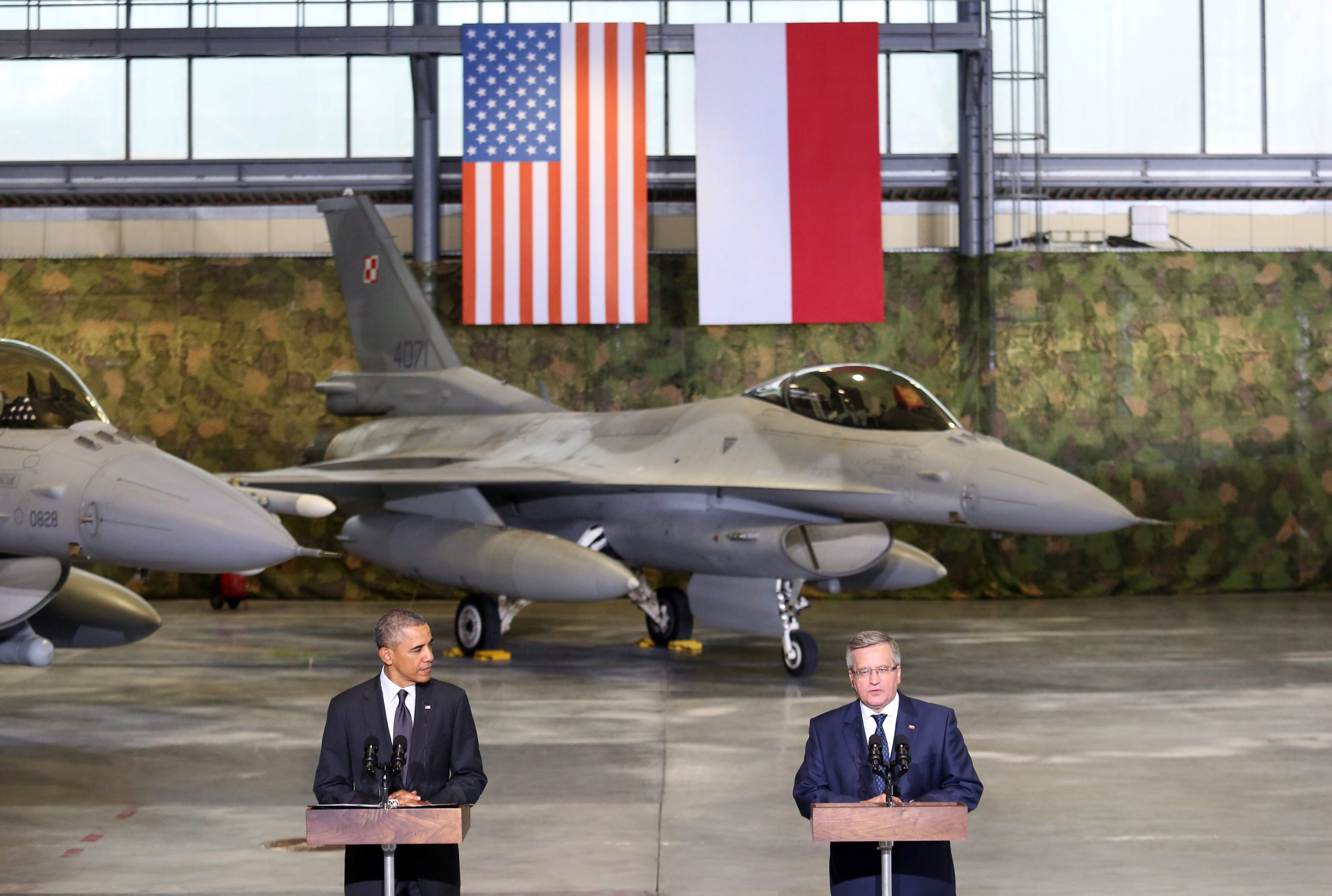 President of Poland Bronislaw Komorowski (R) and U.S. President Barack Obama (L) attend a meeting with Polish and US F-16 fighters pilots at the Okecie Airport in Warsaw, Poland, June 3, 2014. (Leszek Szymanski—EPA)