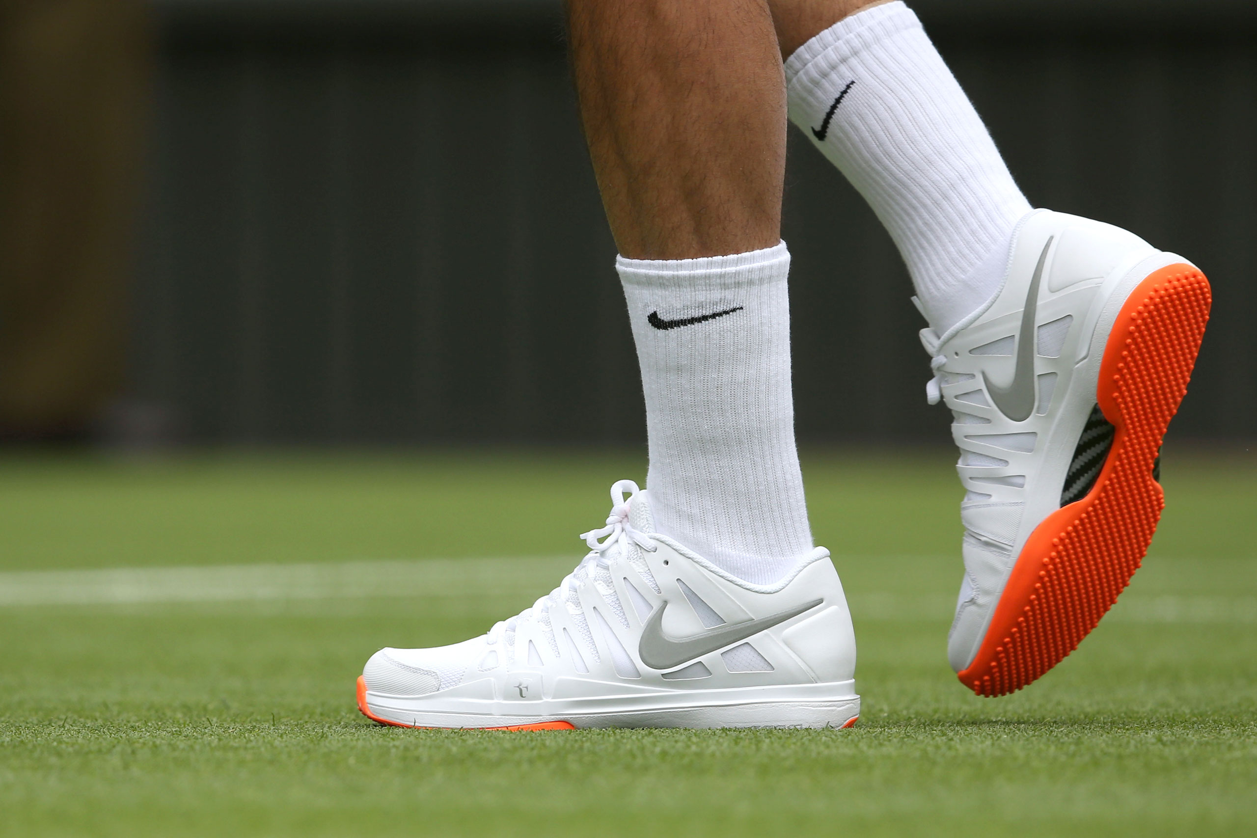 Roger Federer's orange soled Nike shoes were banned by Wimbledon officials in 2013 for violating the tournament’s all-white dress code.