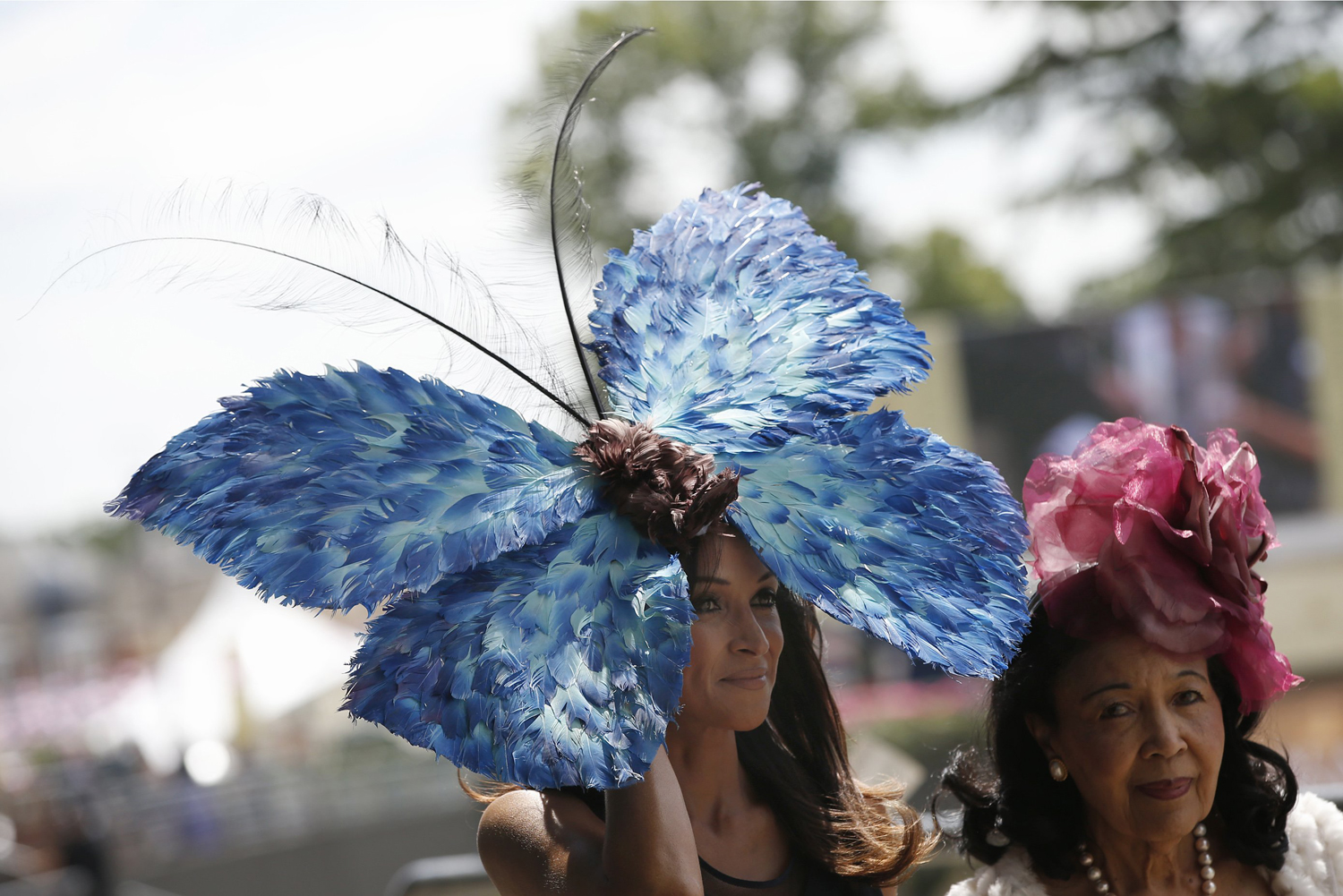 A race goer wears a butterfly design ornate hat on the first day of the Royal Ascot horse racing meeting at Ascot, England, June 17, 2014.