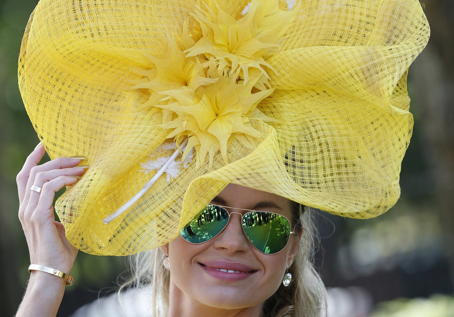 Ester Dohnalova poses for a photograph, on the first day of the Royal Ascot horse racing meeting, in Ascot, England, June 17, 2014.