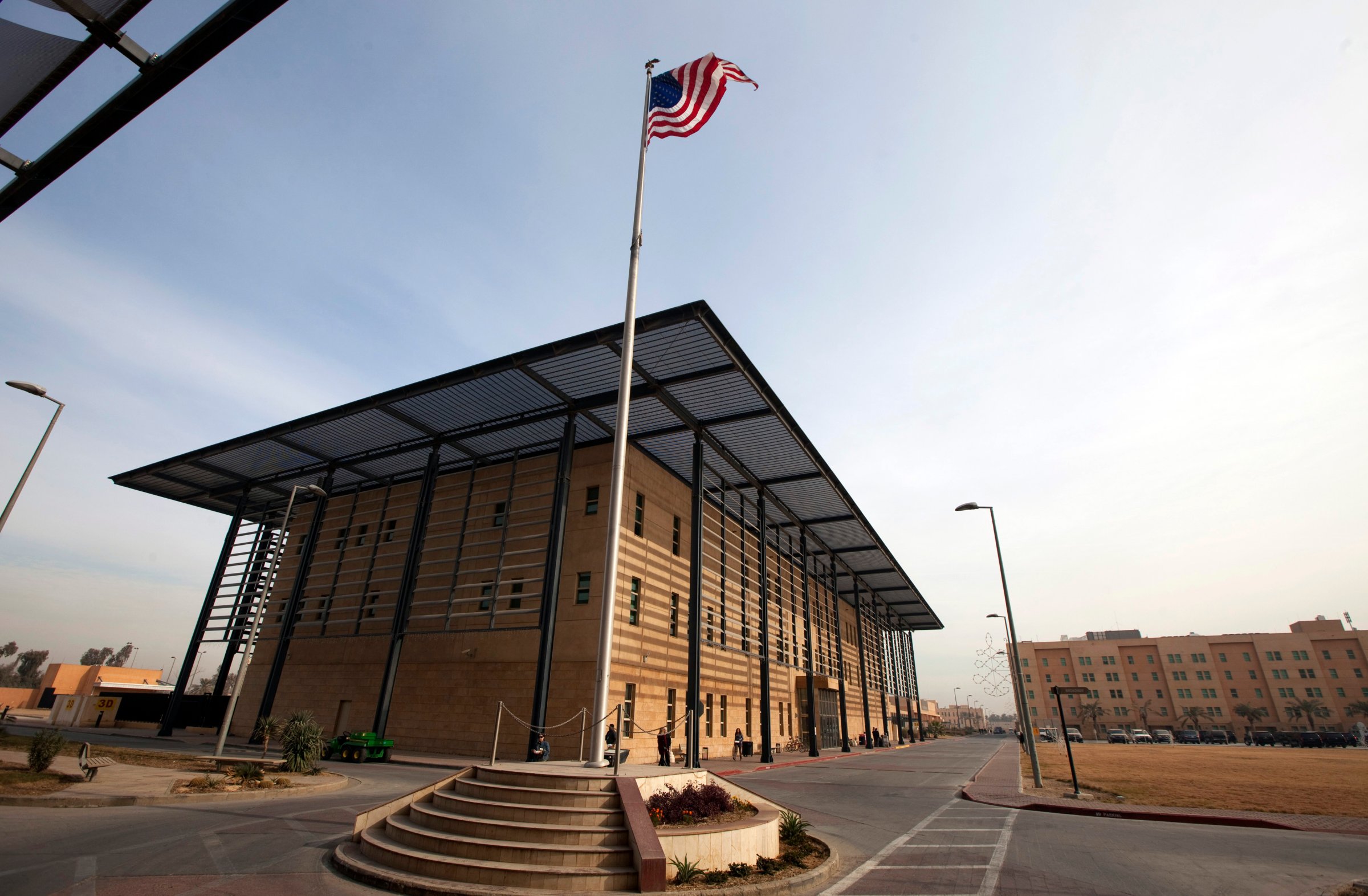 A U.S. flag flies in front of the Annex I building inside the compound of the U.S. embassy in Baghdad