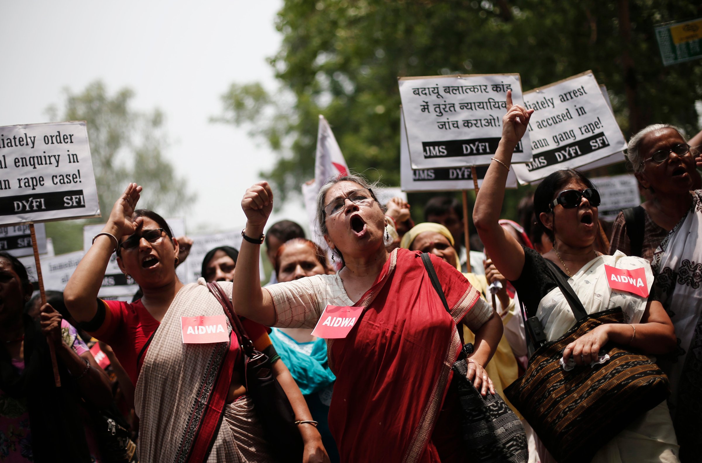 Demonstrators from All India Democratic Women's Association hold placards and shout slogans during protest against recent killings of two teenage girls, in New Delhi